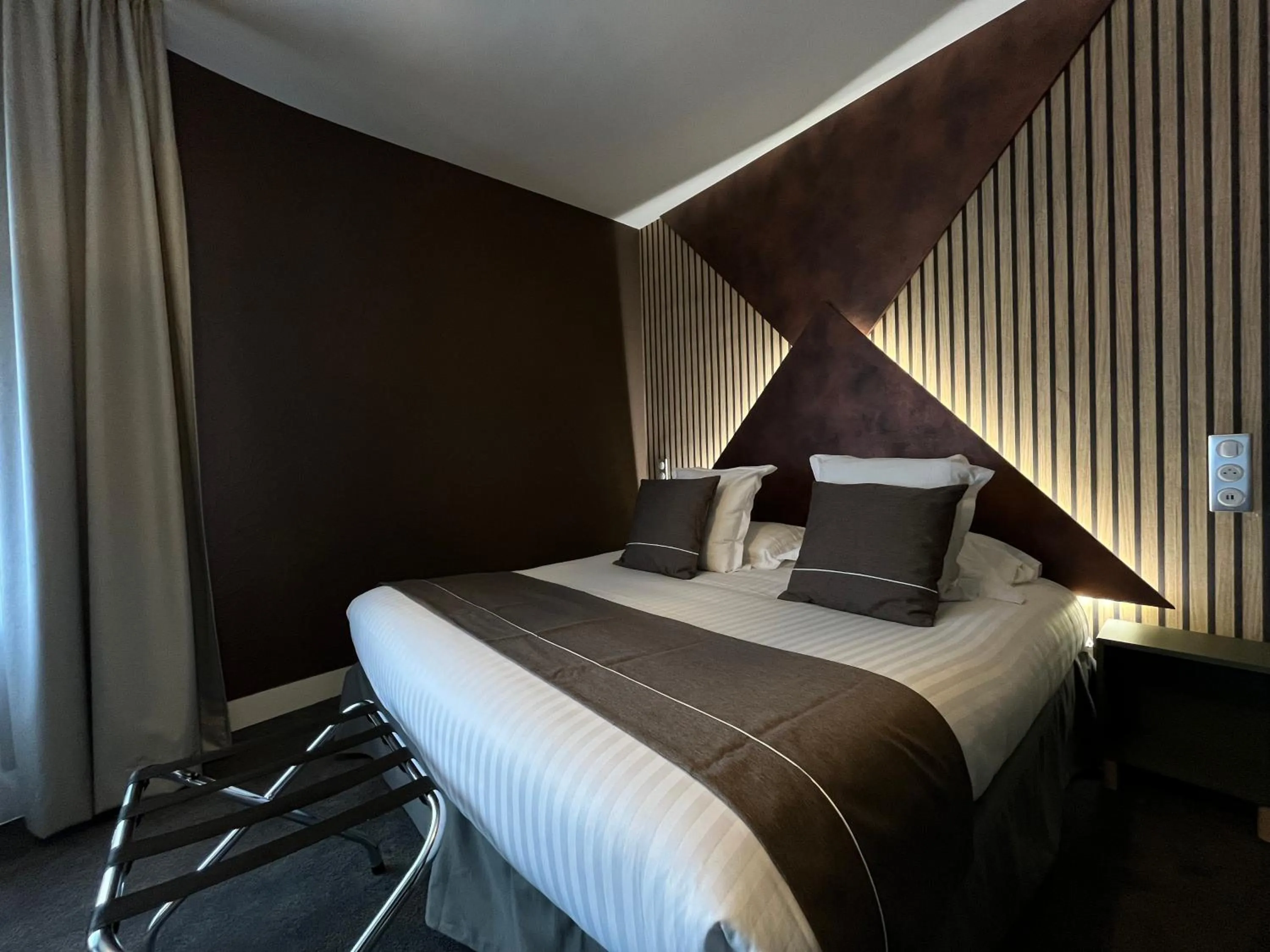 Bed in LOGIS Hôtel Borel