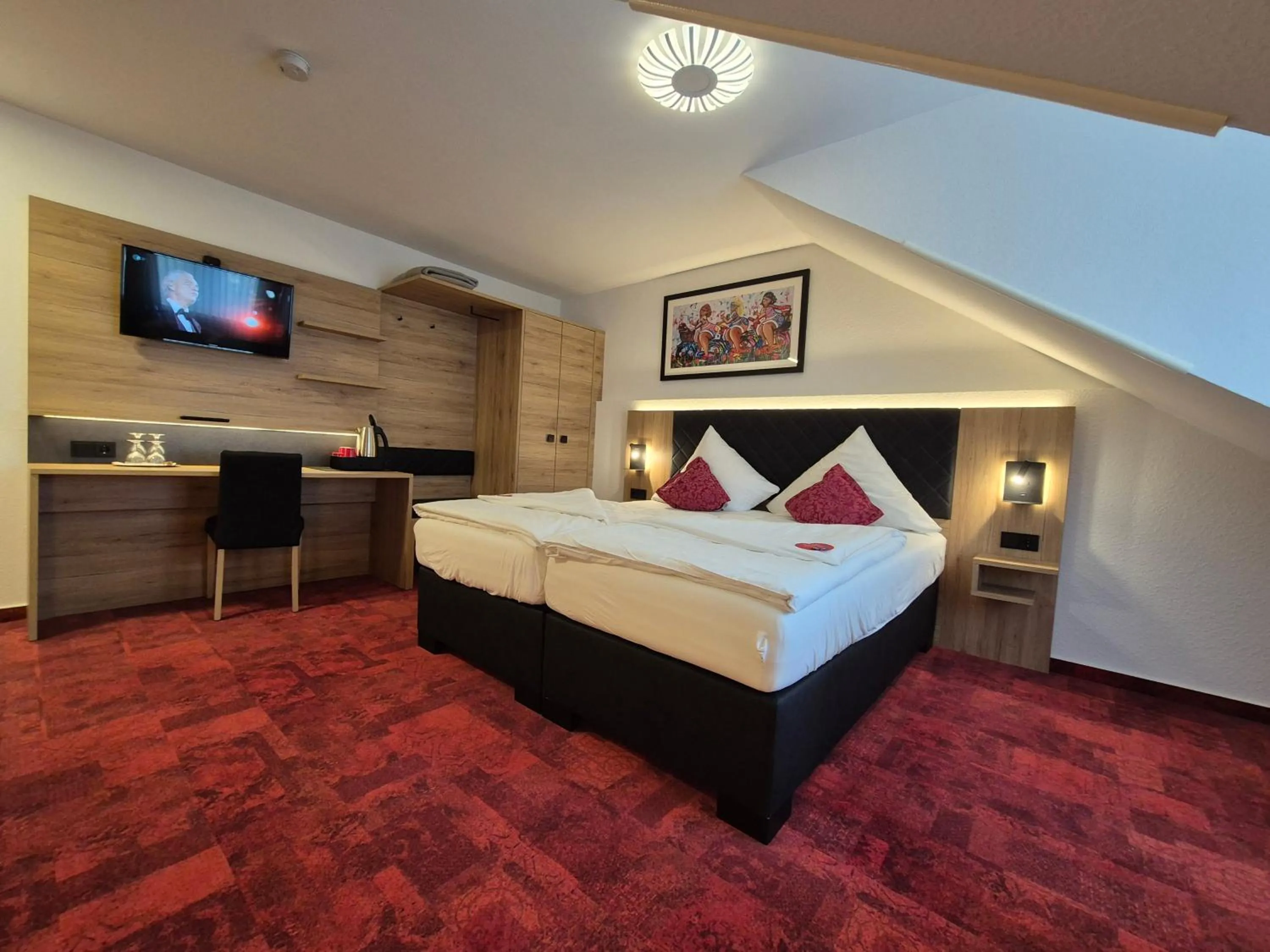 Bed in Hotel St. Georg Garni