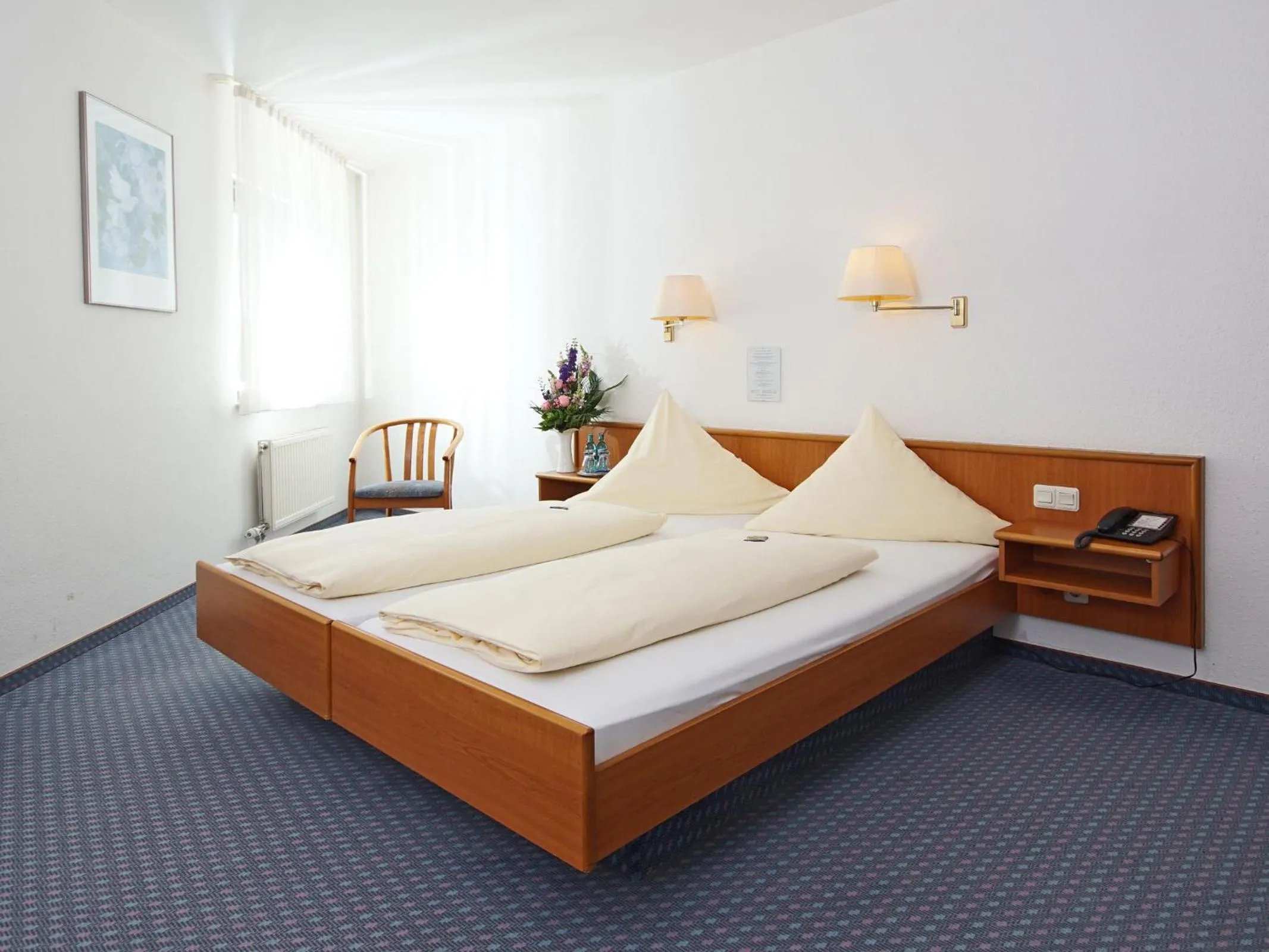 Bed in City Hotel Mark Michelstadt