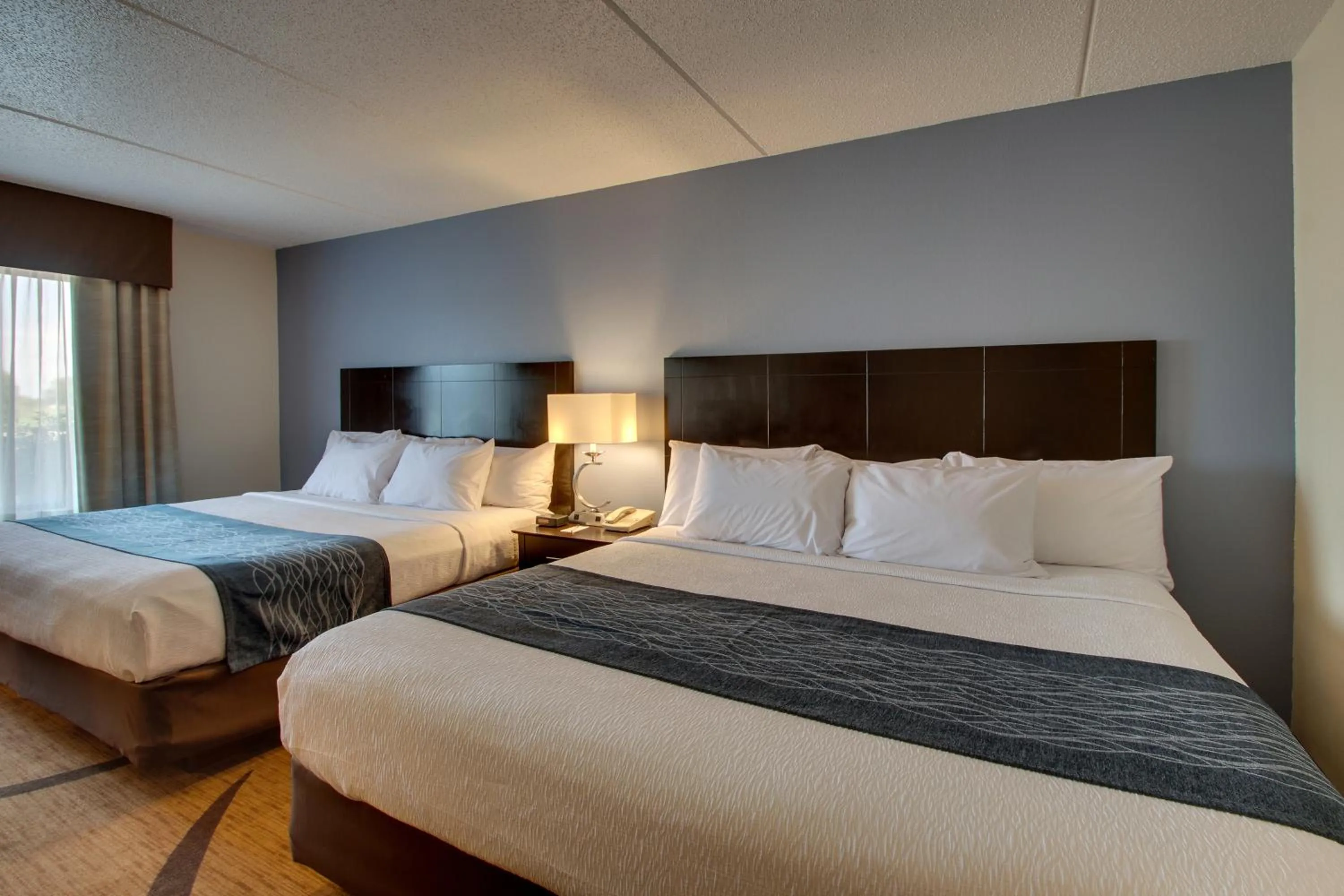 Bed in Greenfield Inn & Suites Owensboro, KY Airport