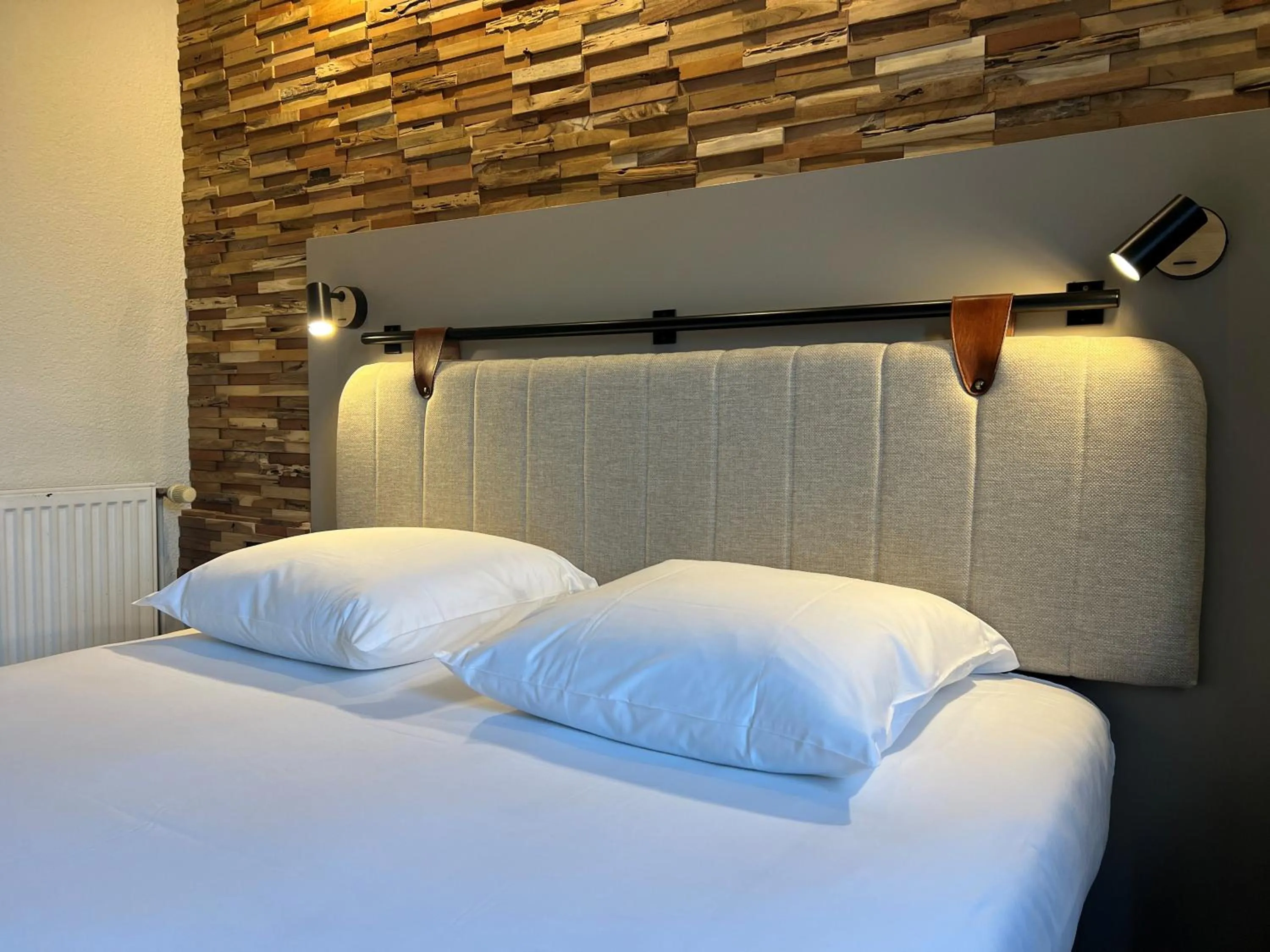 Decorative detail, Bed in Tulip Inn Beaune