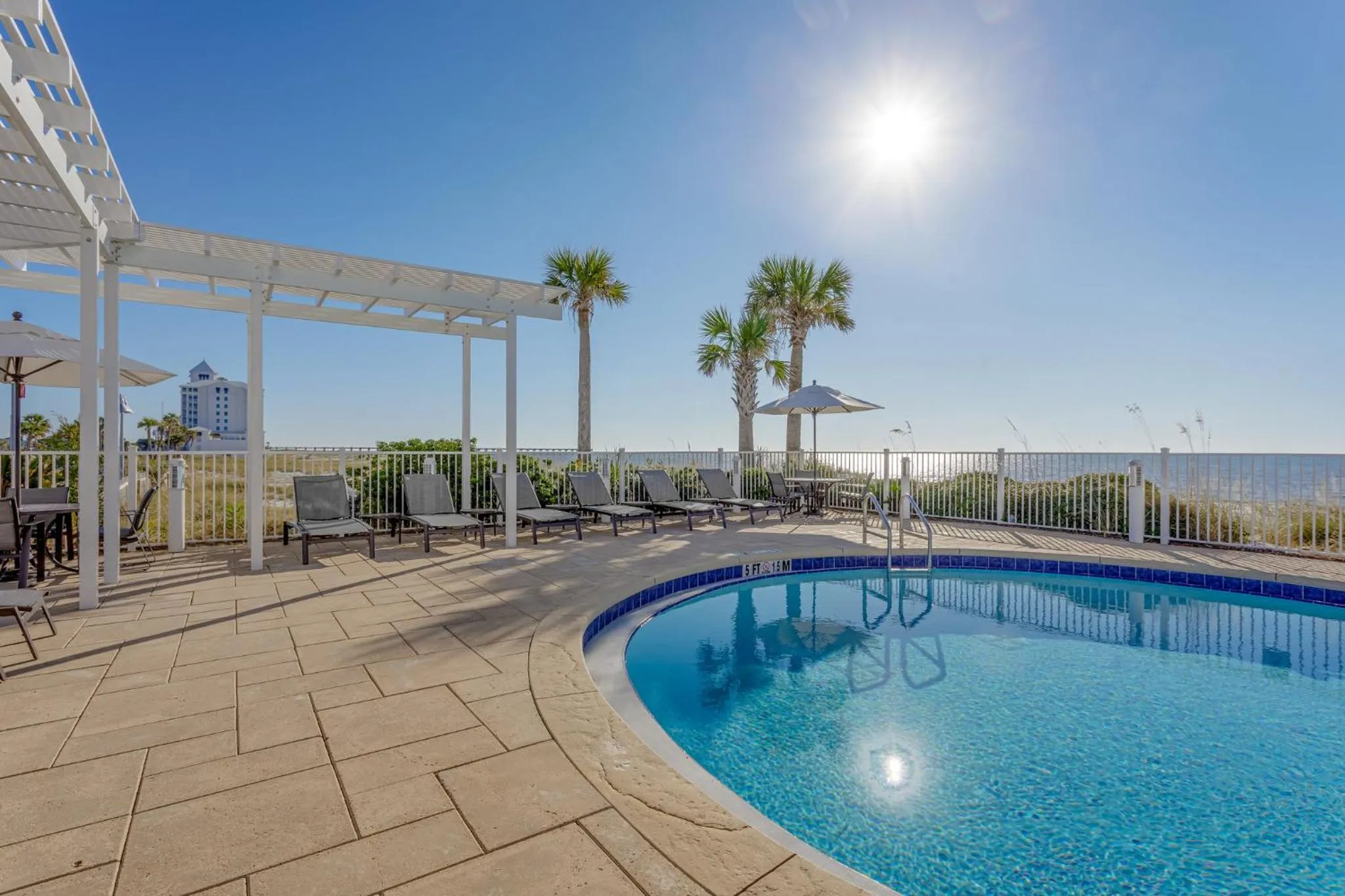 Swimming pool in Holiday Inn Express Pensacola Beach by IHG