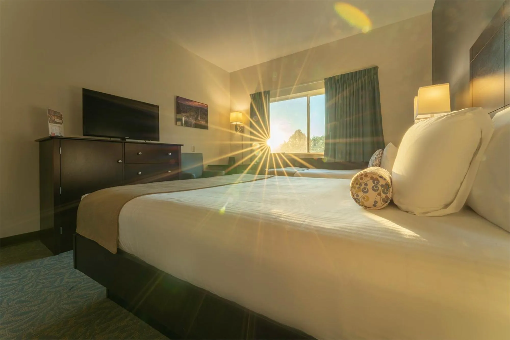 Bed in Sun & Ski Inn and Suites