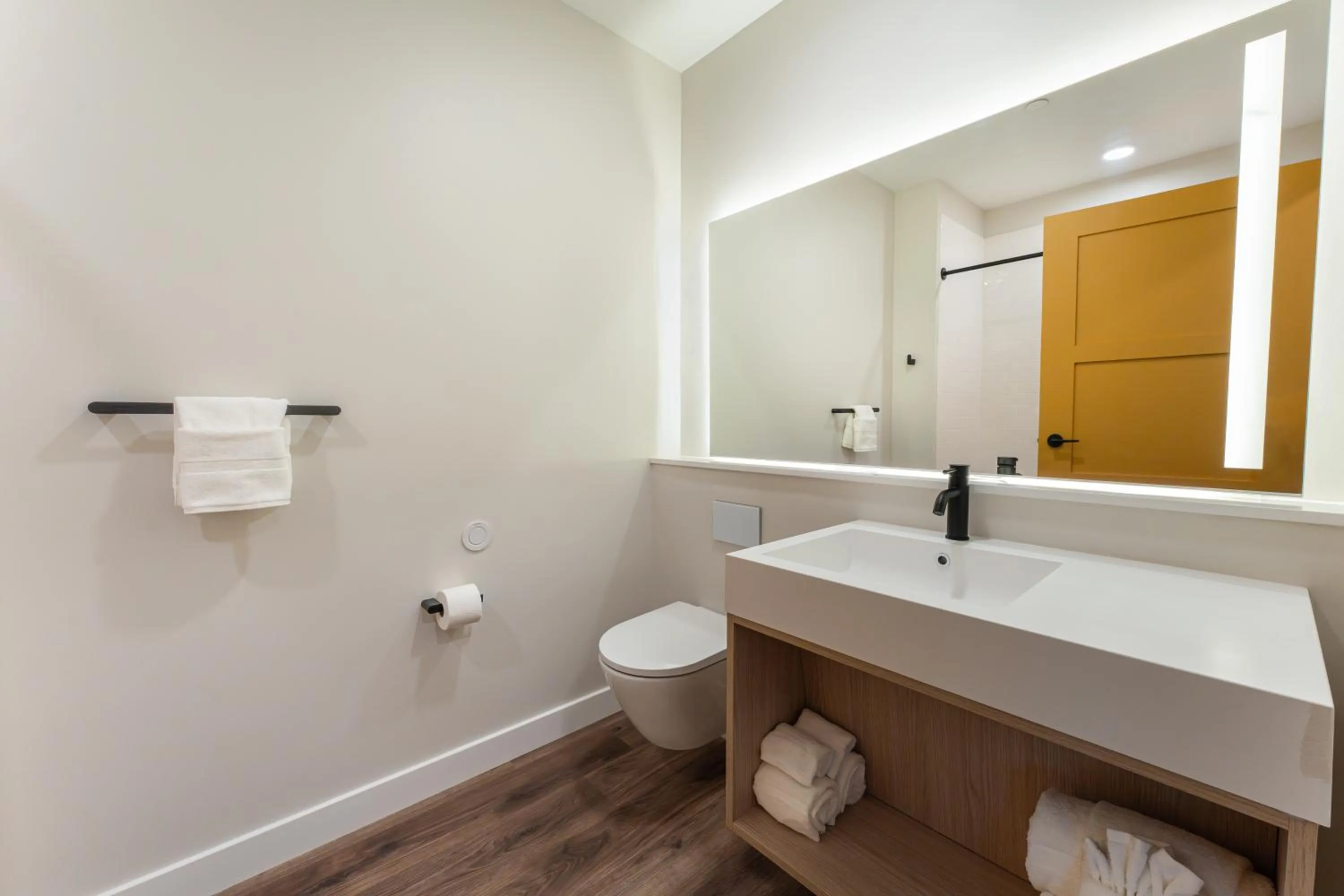 Toilet in Sun & Ski Inn and Suites