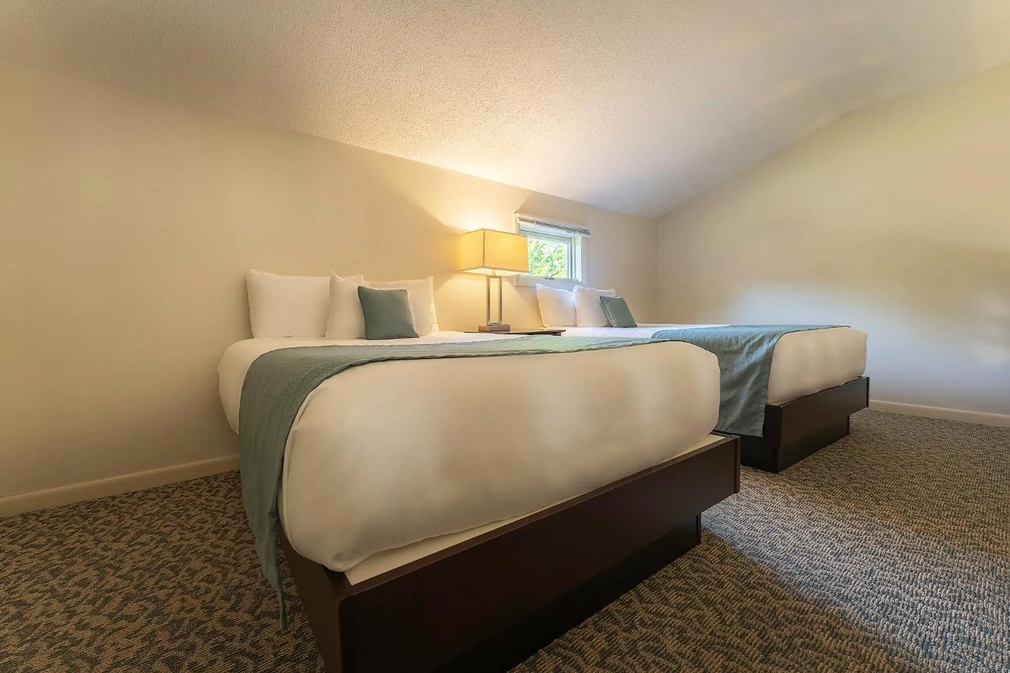 Bed in Sun & Ski Inn and Suites