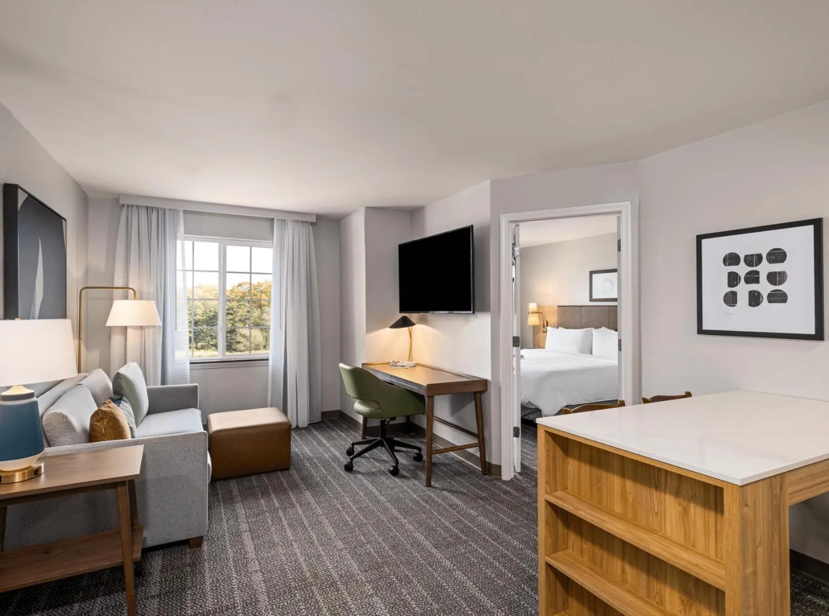 Living room, Bed in Staybridge Suites Rochester University by IHG