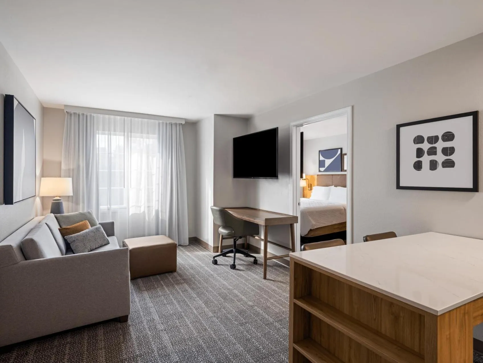 Living room, Bed in Staybridge Suites Rochester University by IHG
