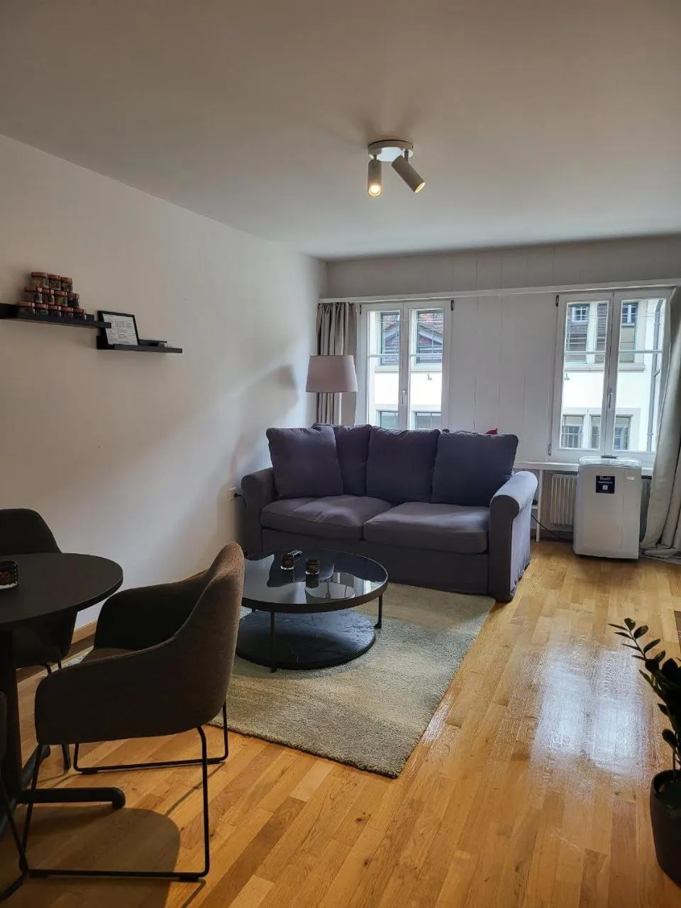 Living room in Stylish Apartment in the Heart of Zug by Airhome