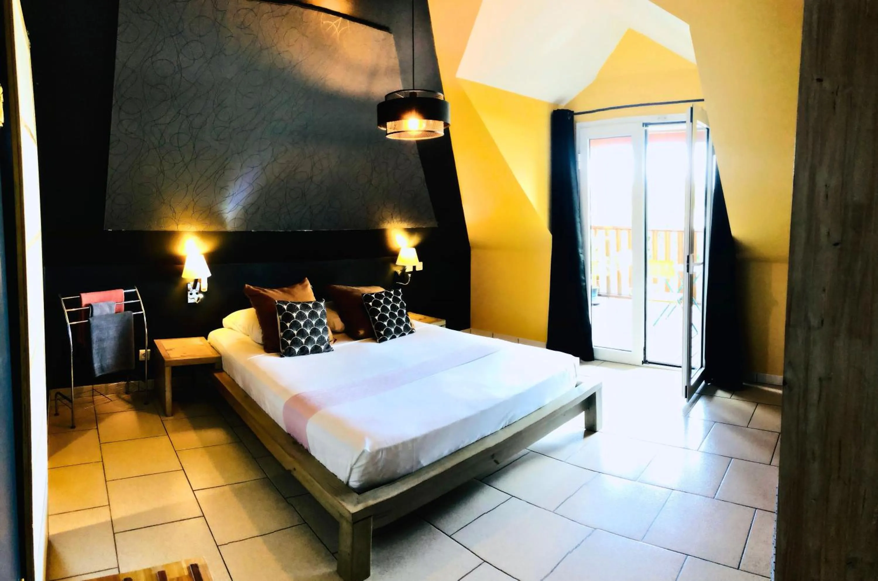 Bed in Hôtel les Bougainvilliers