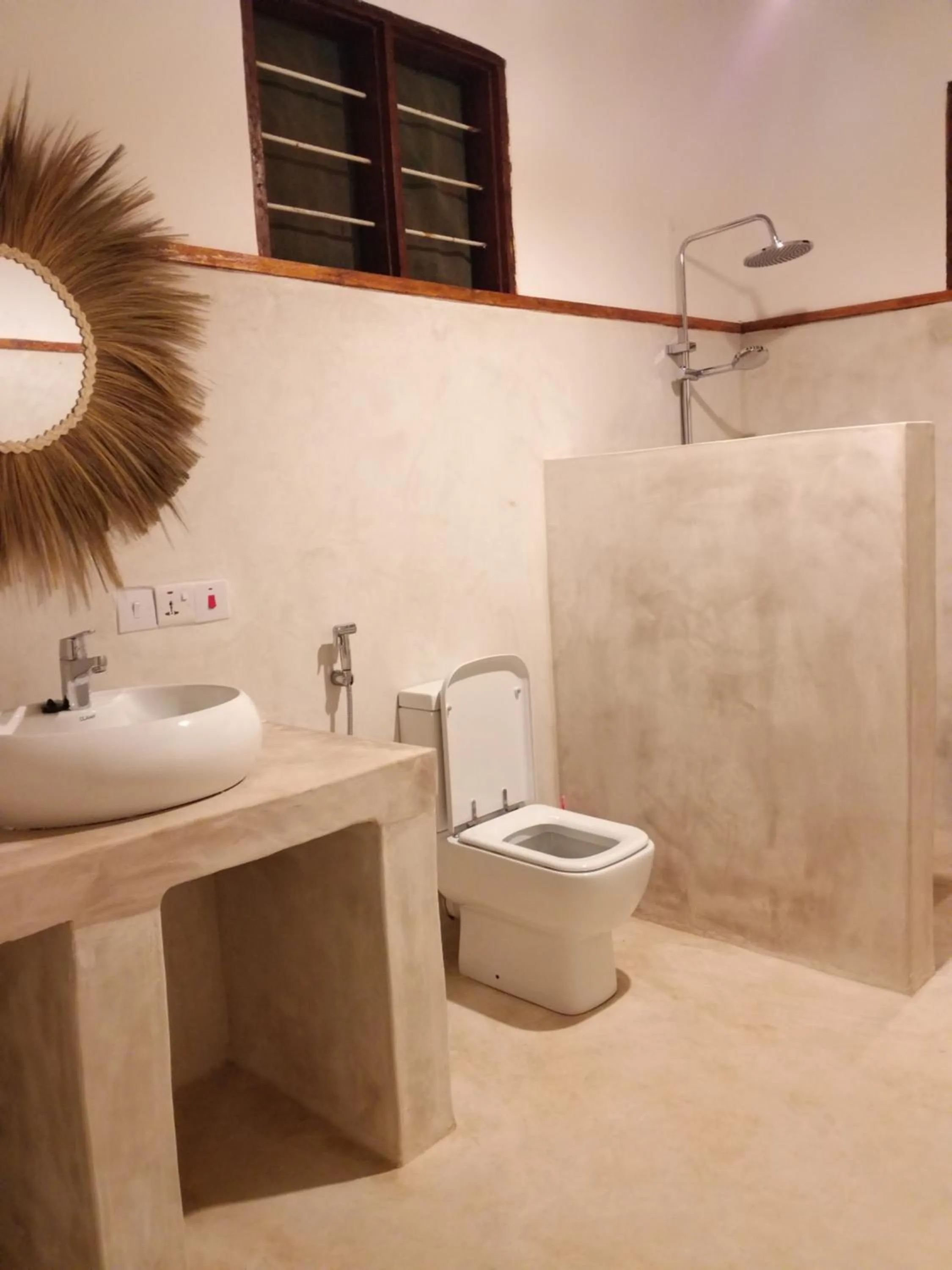 Toilet in Mpole Bungalows