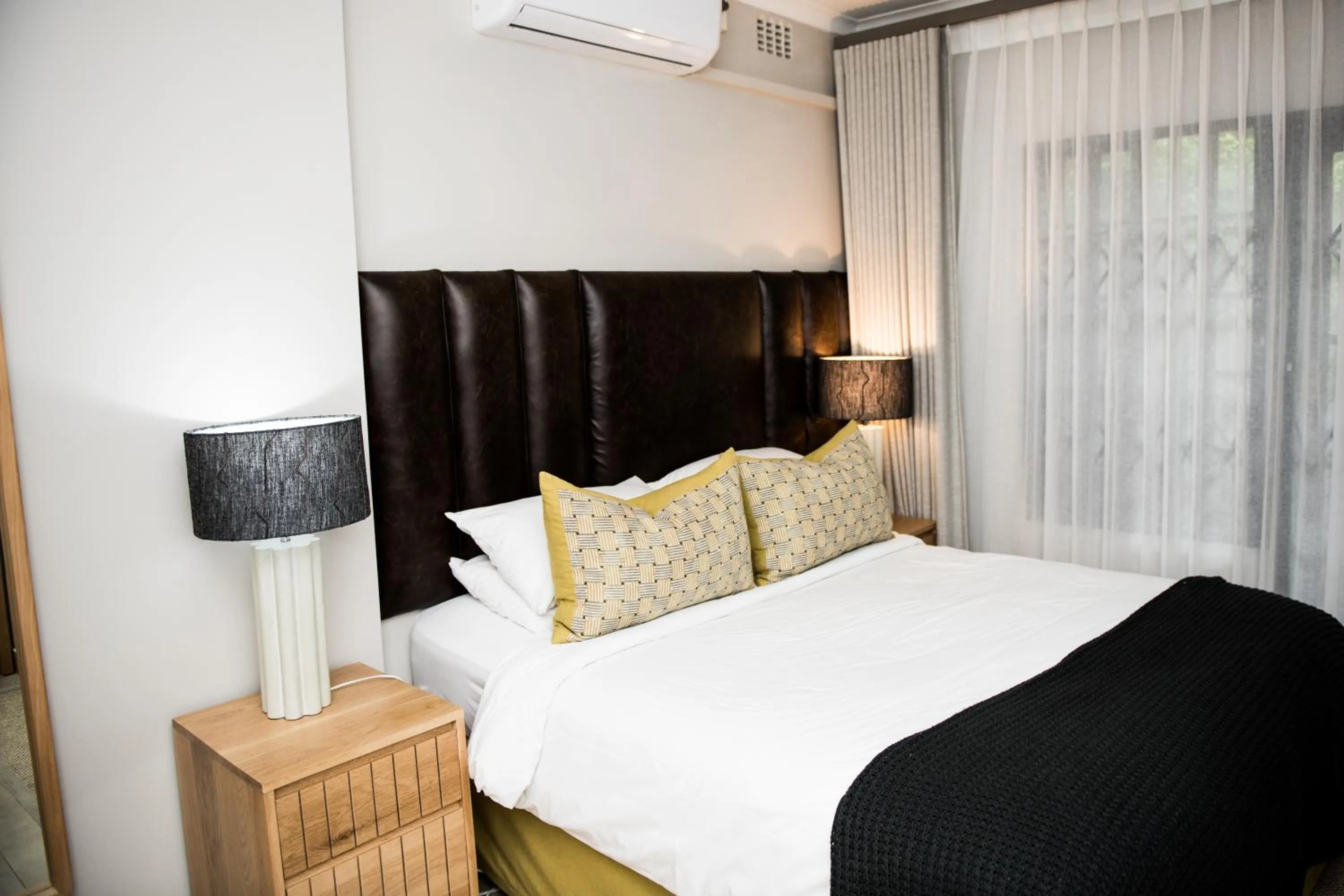 Bed in Tropical Beach Boutique Guesthouse