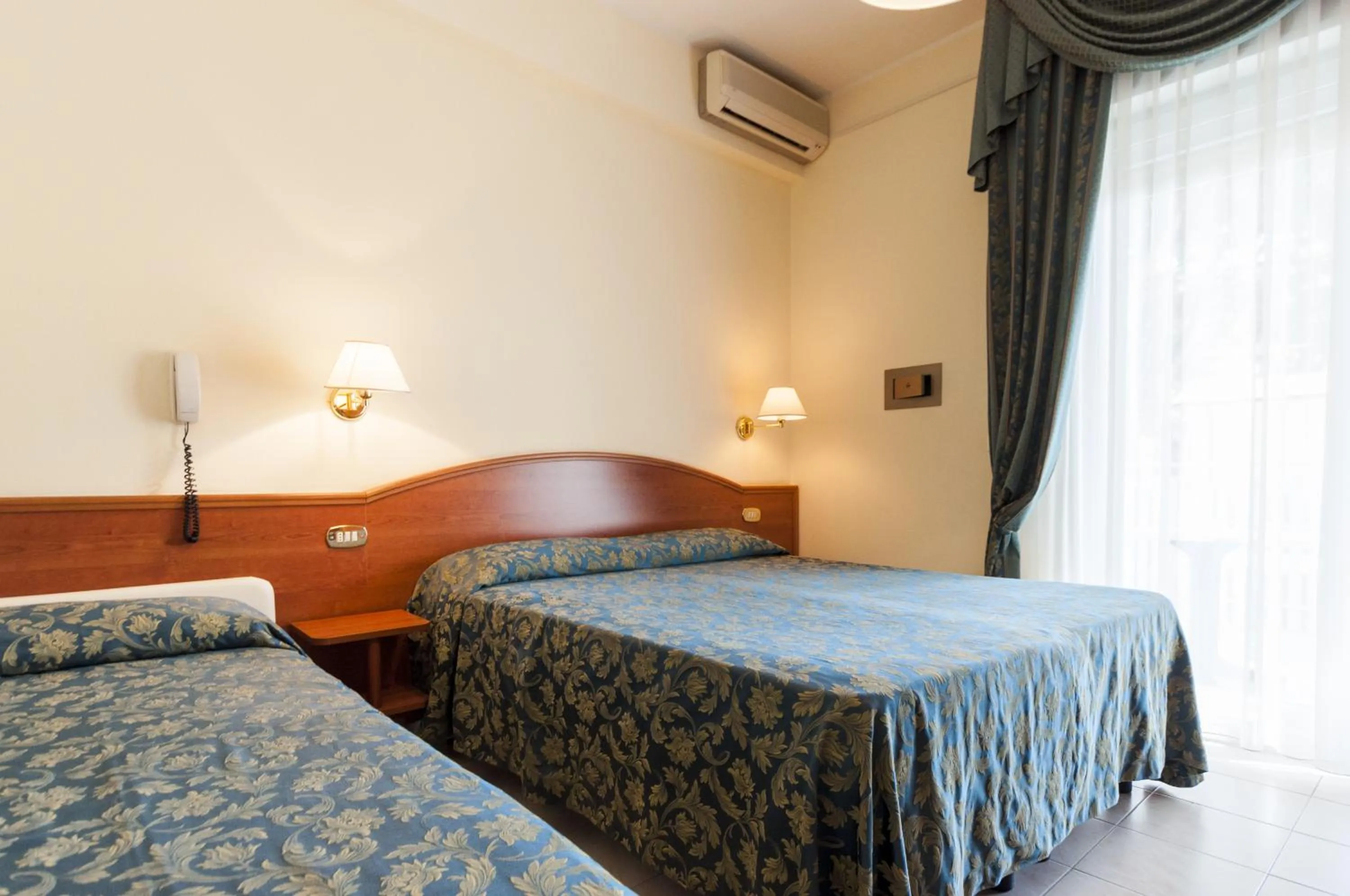 Bed in Hotel Donatella Pinarella