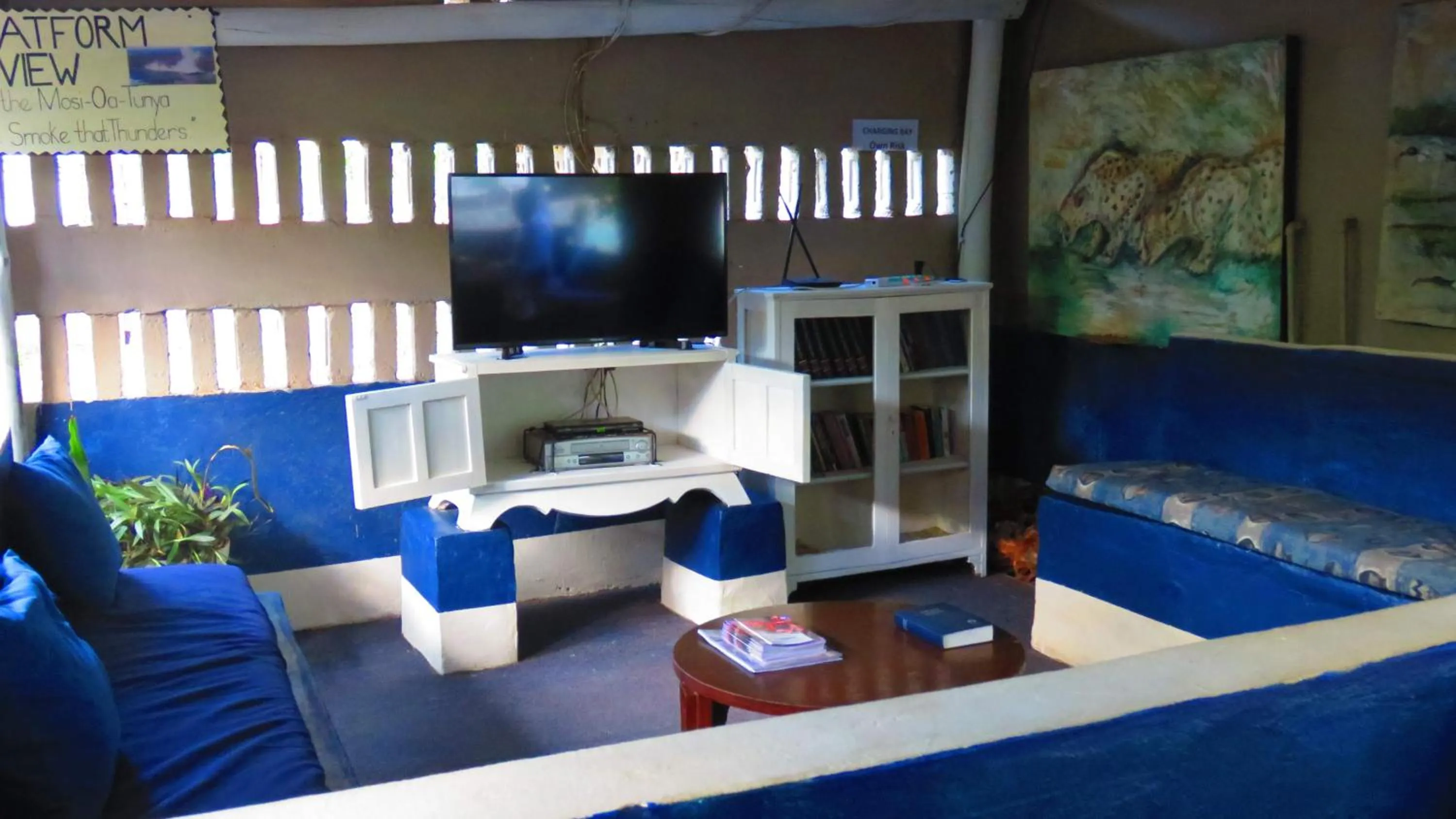 Communal lounge/ TV room in Victoria Falls Backpackers Lodge