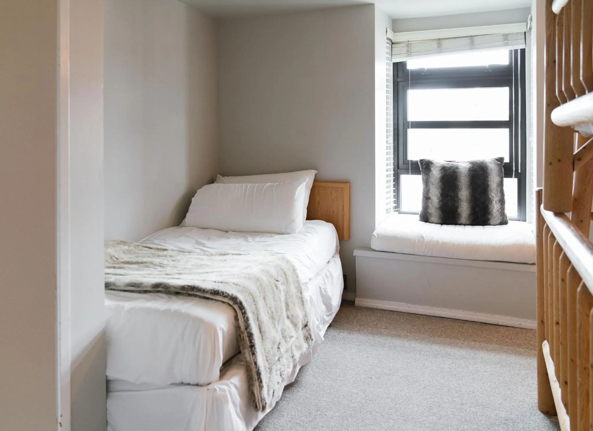 Bed in Gibbons Life Accommodations