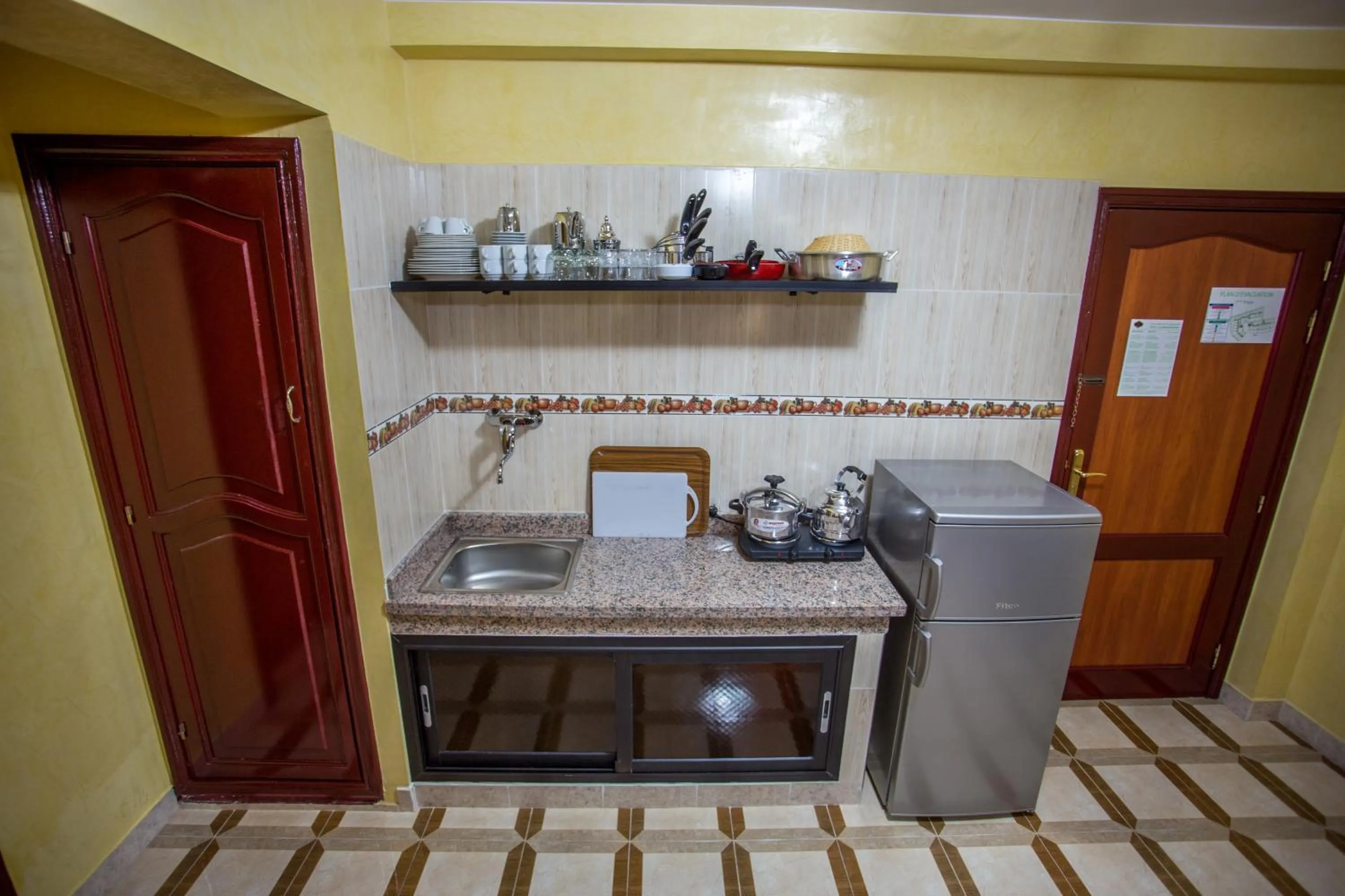 Kitchen or kitchenette in Appart Hotel Les Ambassadeurs