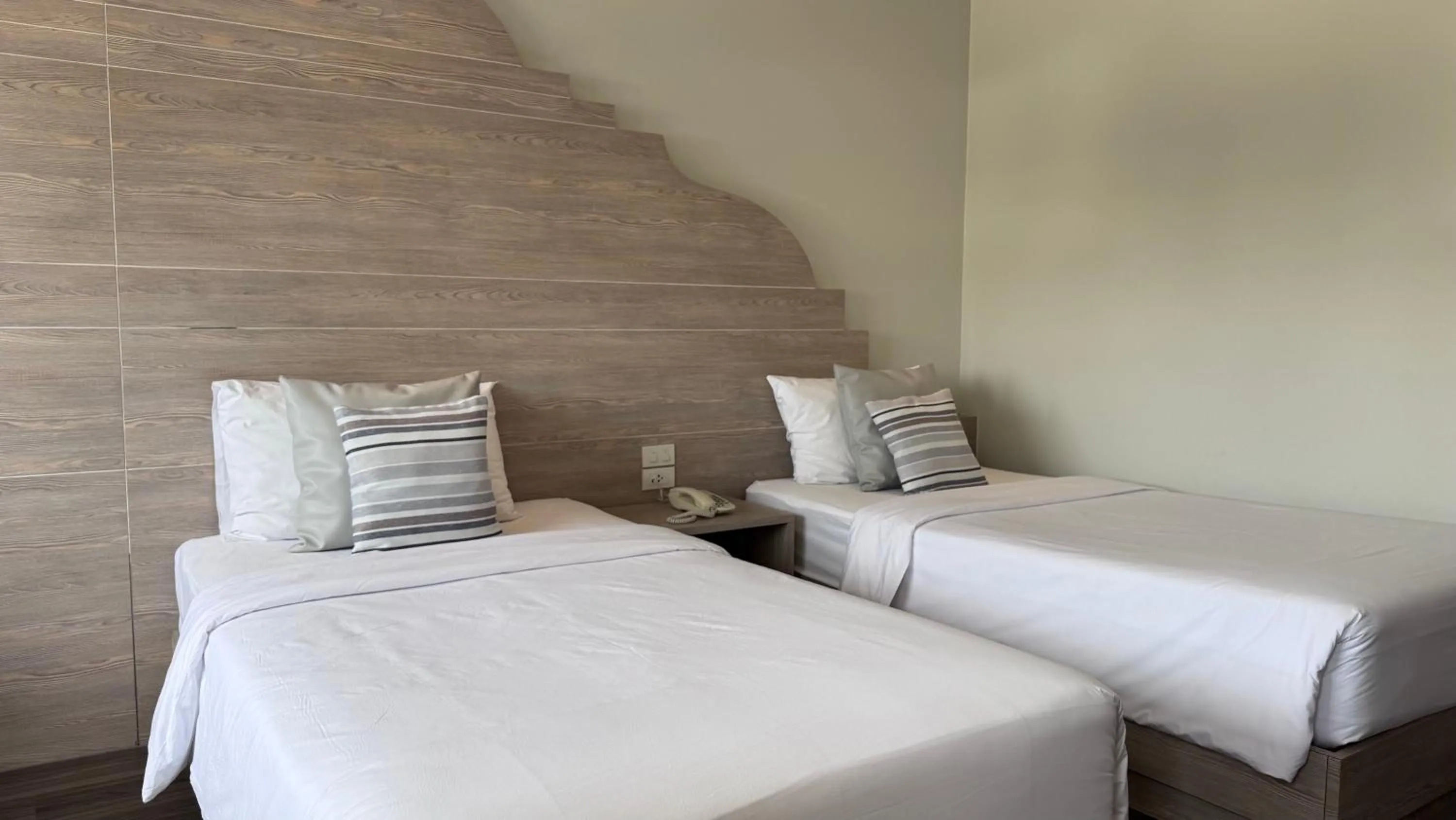 Bed in Methavalai Residence Hotel