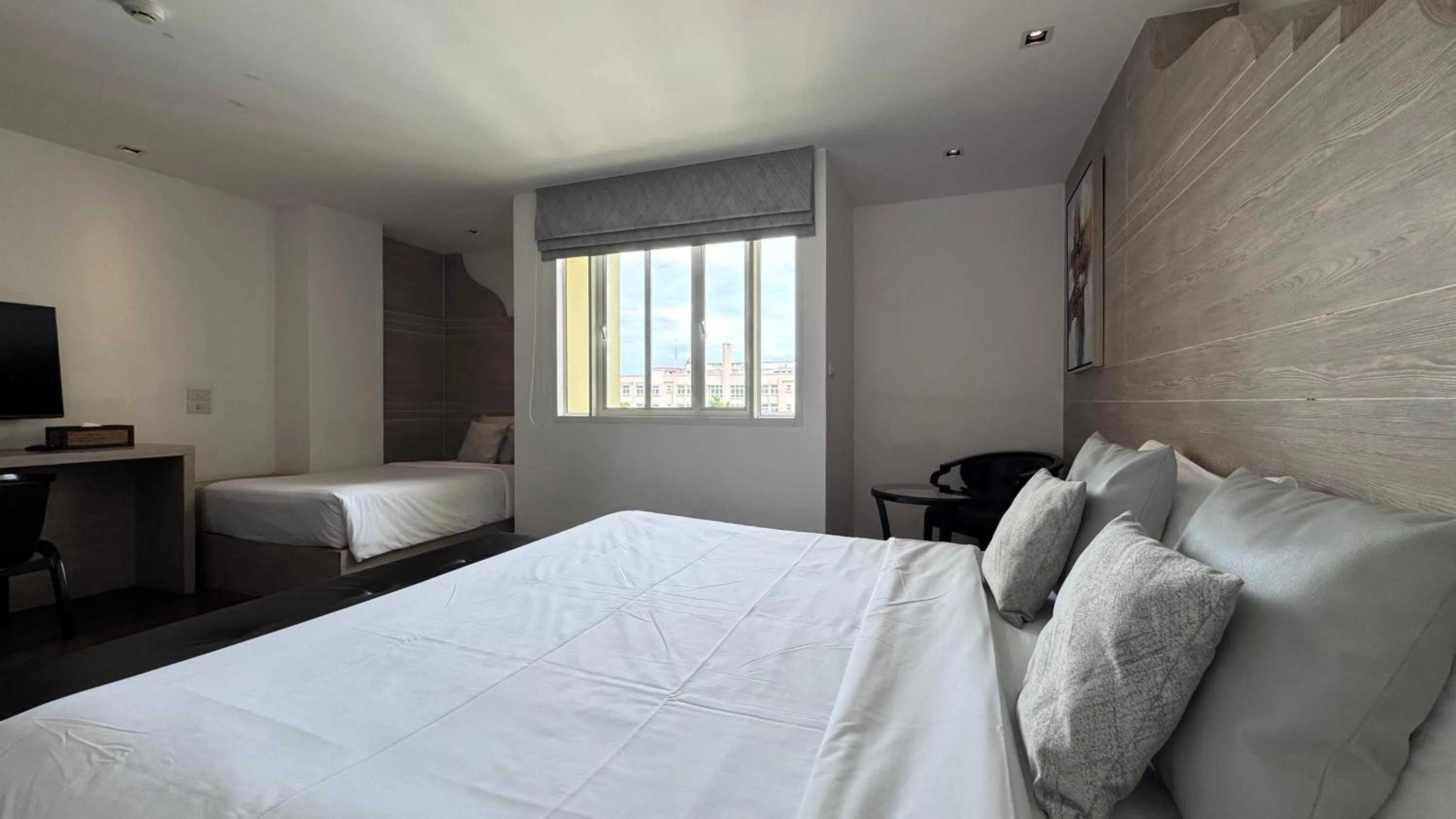 Bed in Methavalai Residence Hotel