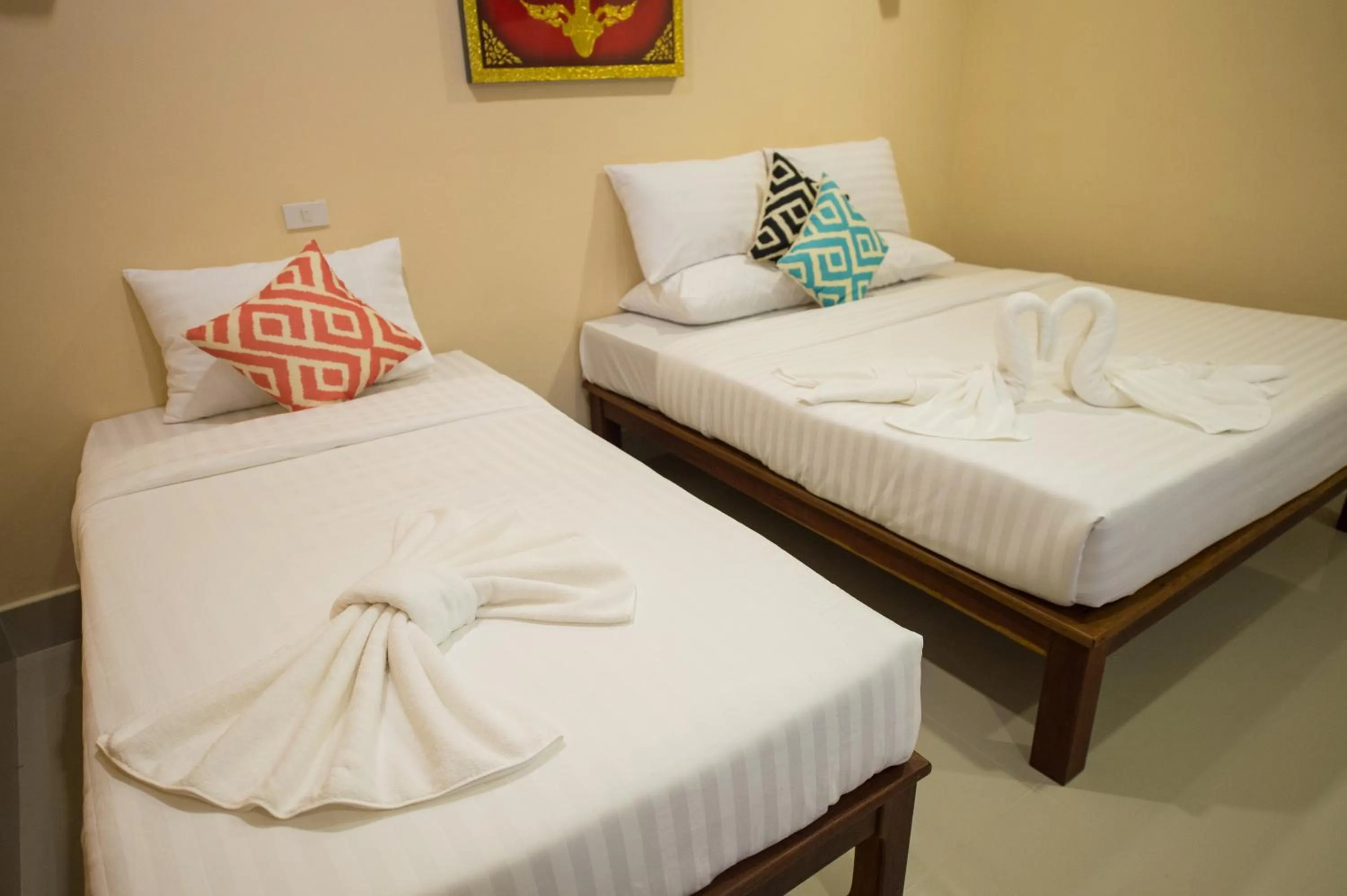 towels, Bed in Sri Siam Resort