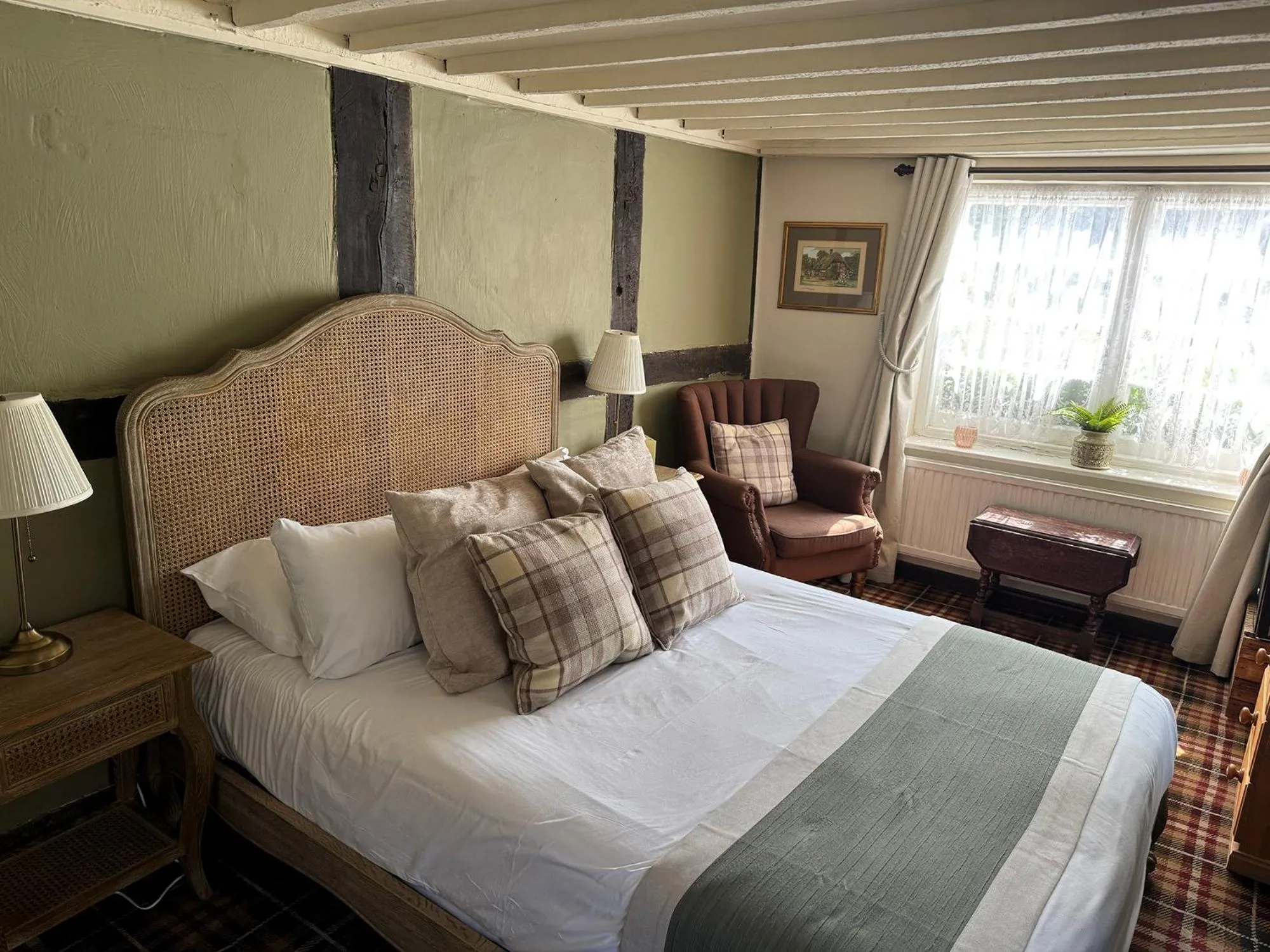 Bed in Thatched Cottage Hotel