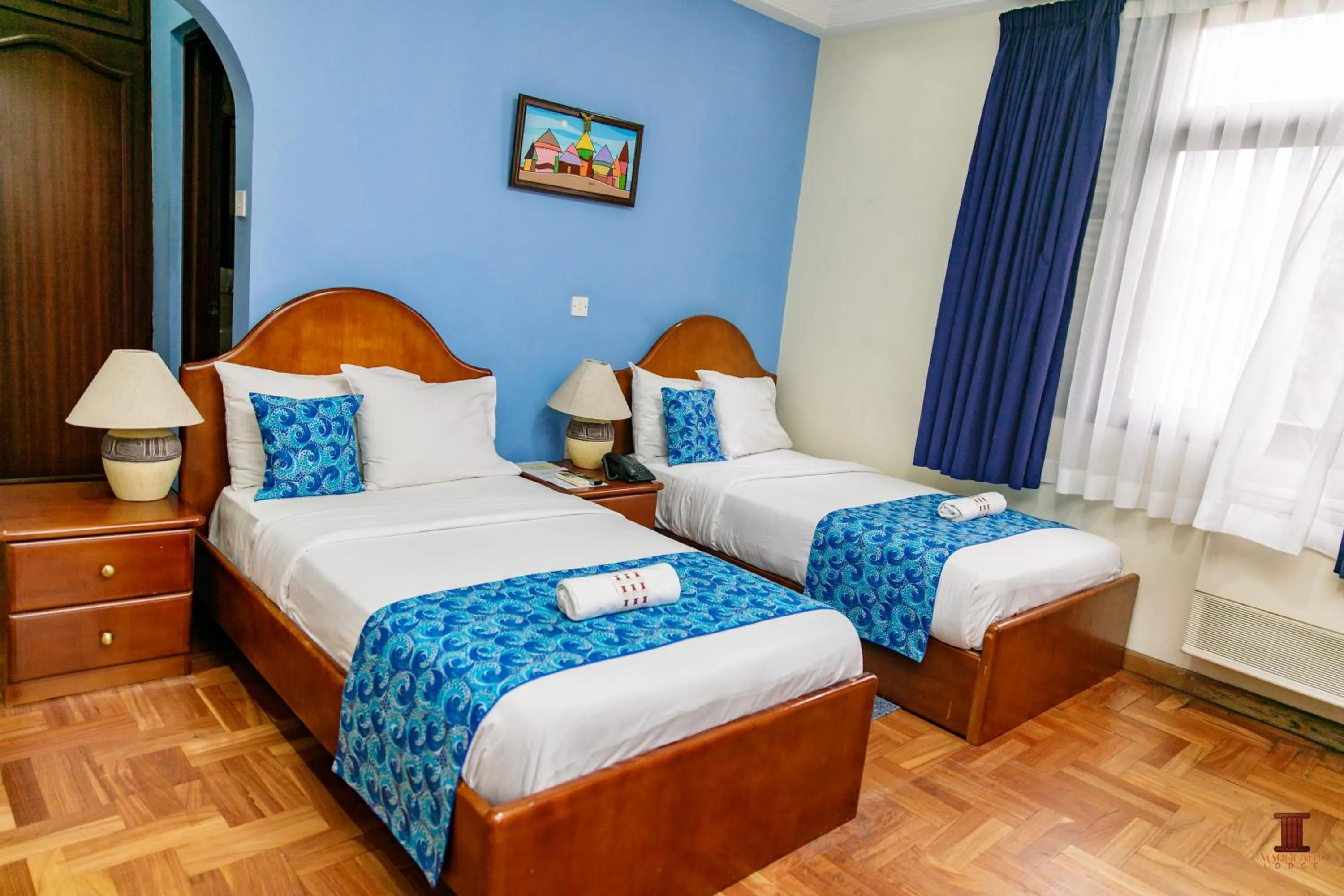 Bed in Mahogany Lodge, Cantonments