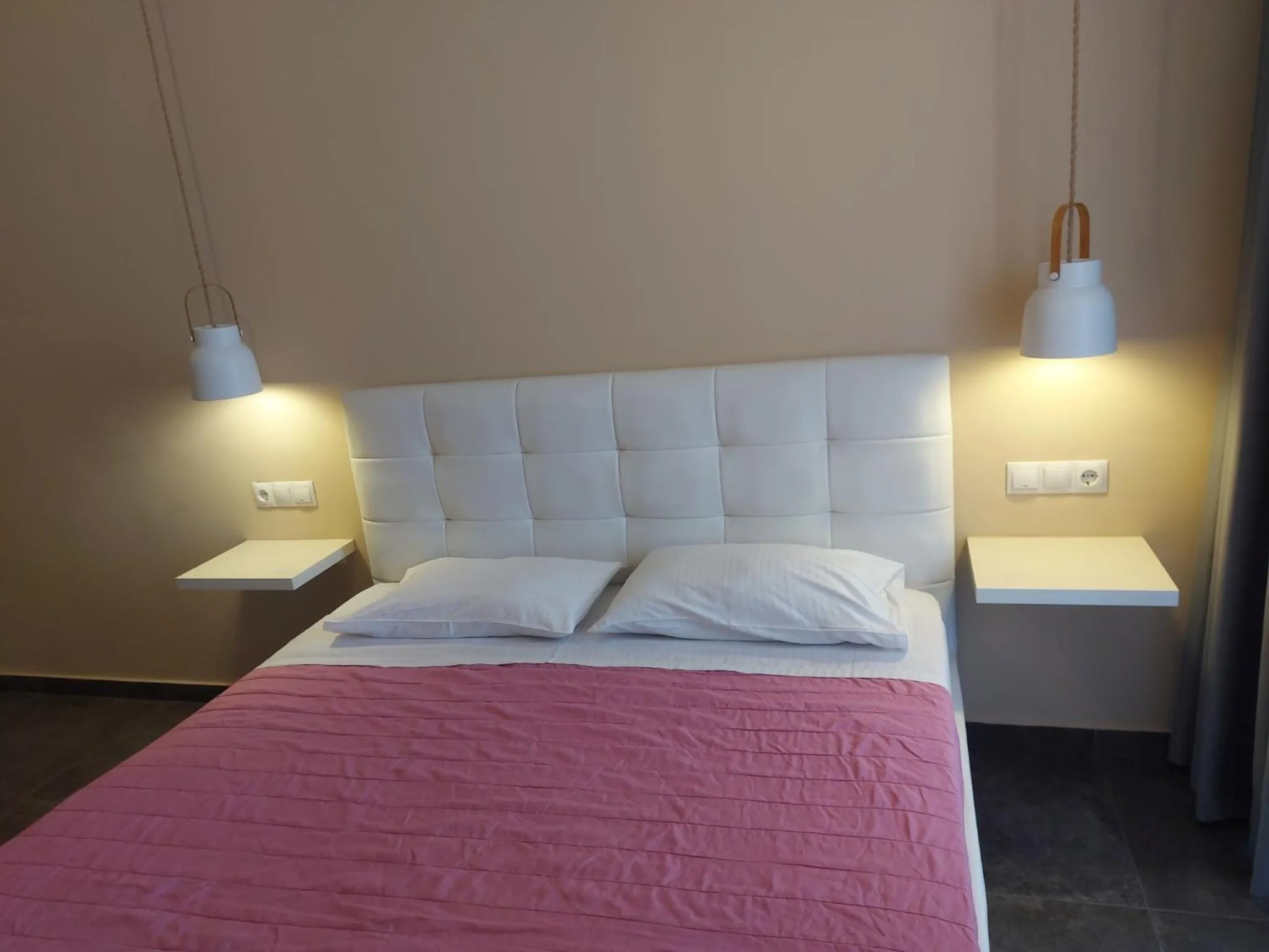 Bed in The Santo George Beach Resort