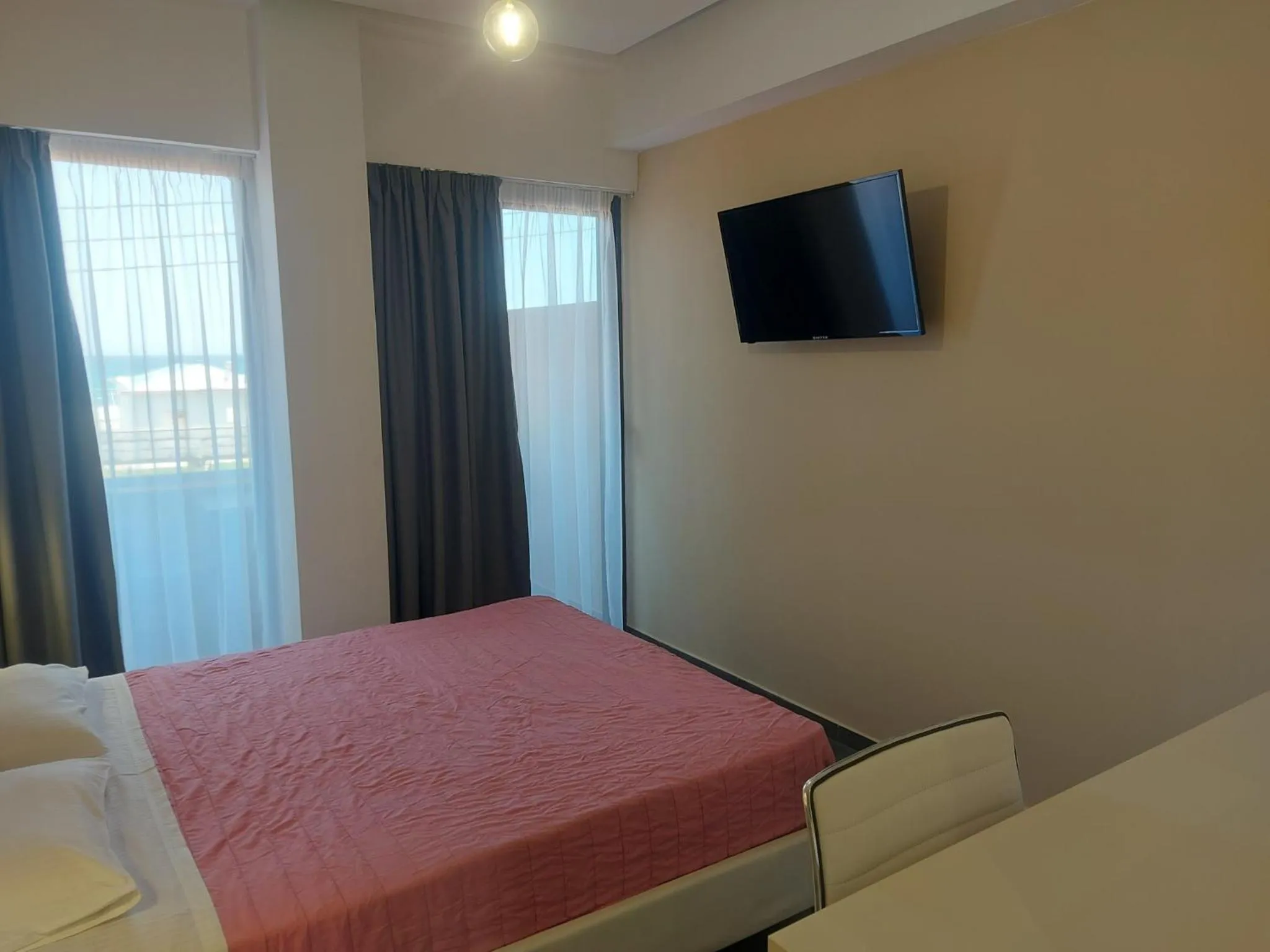 Bed in The Santo George Beach Resort