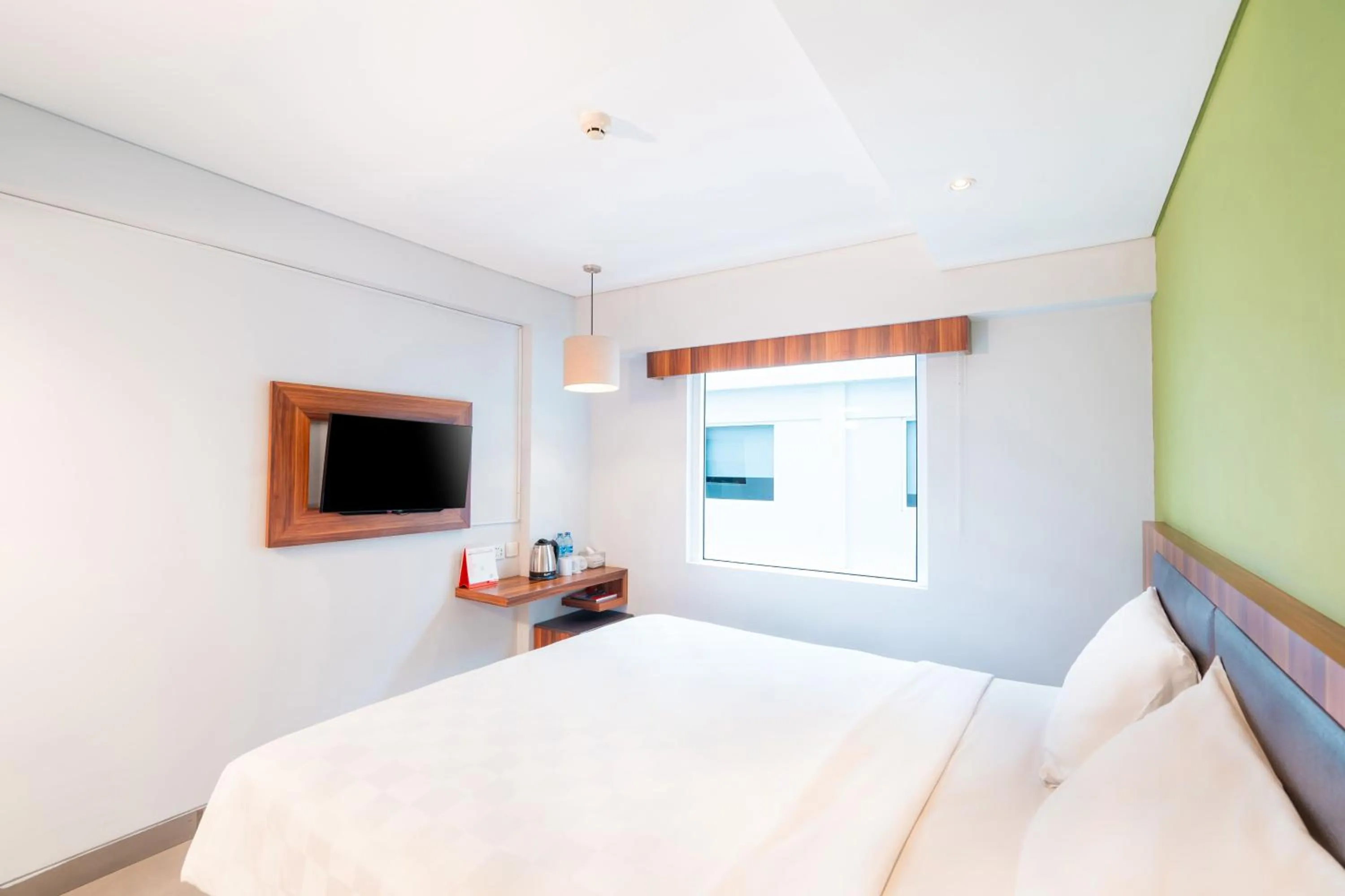 Bed in Swiss-Belexpress Kuta Legian