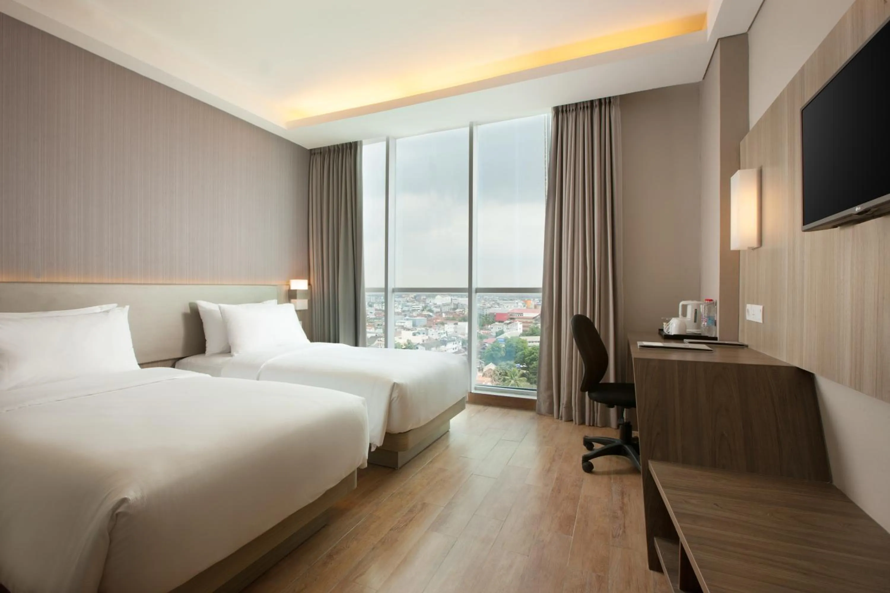 Photo of the whole room, Bed in Hotel Santika Radial Palembang
