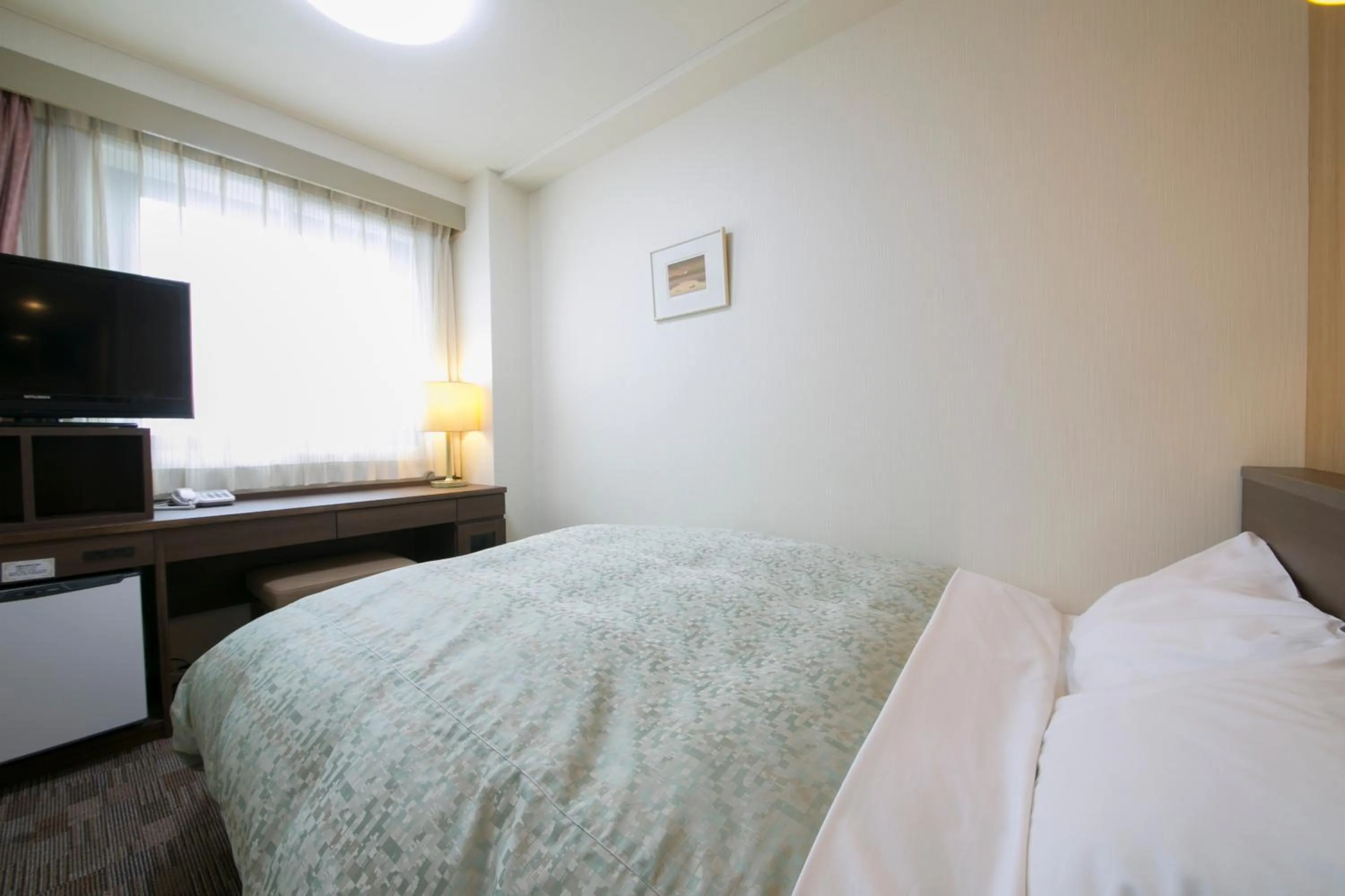 Bed in Yokaichi Royal Hotel