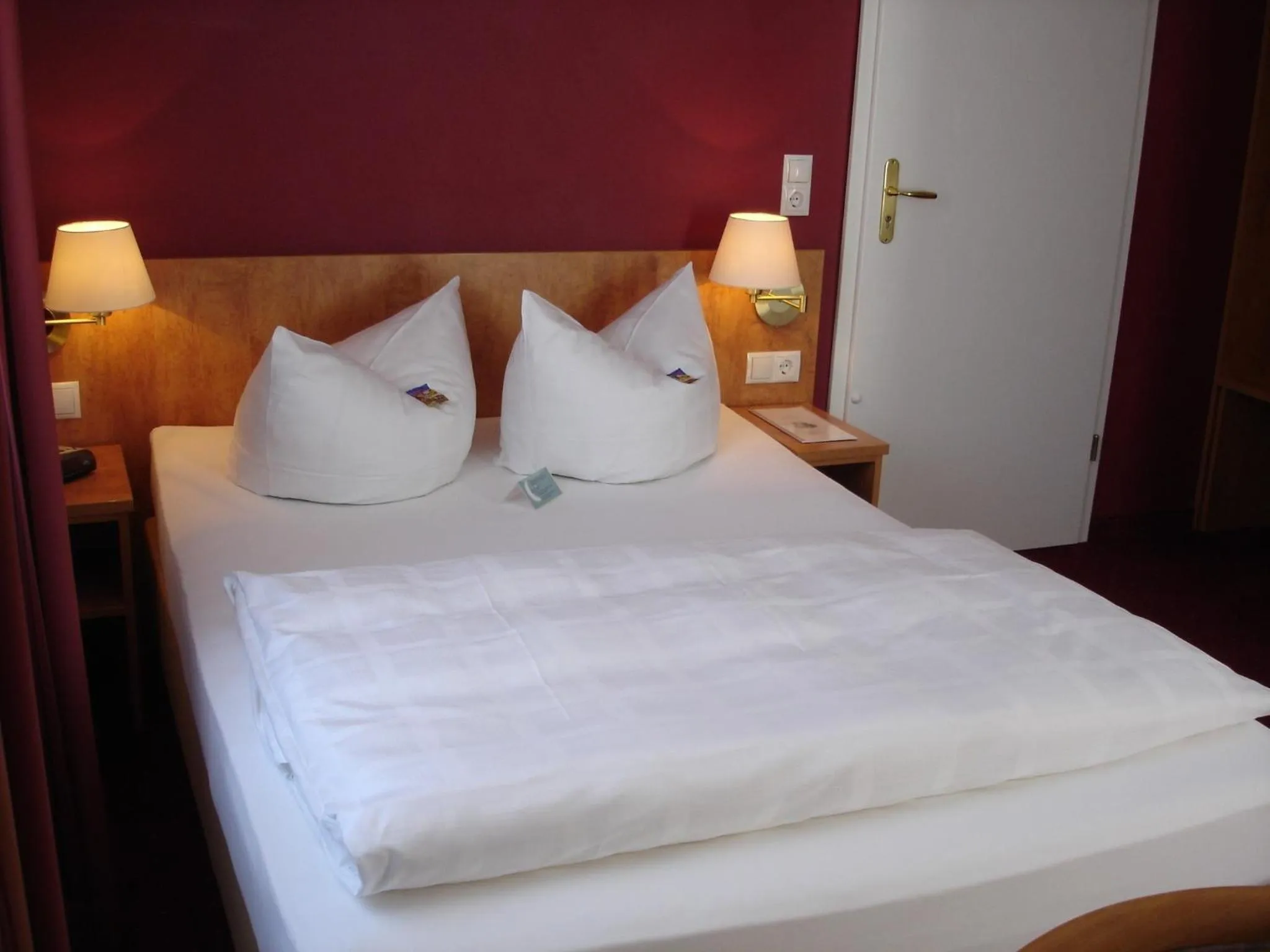 Bed in Sunny´s Hotel & Residence