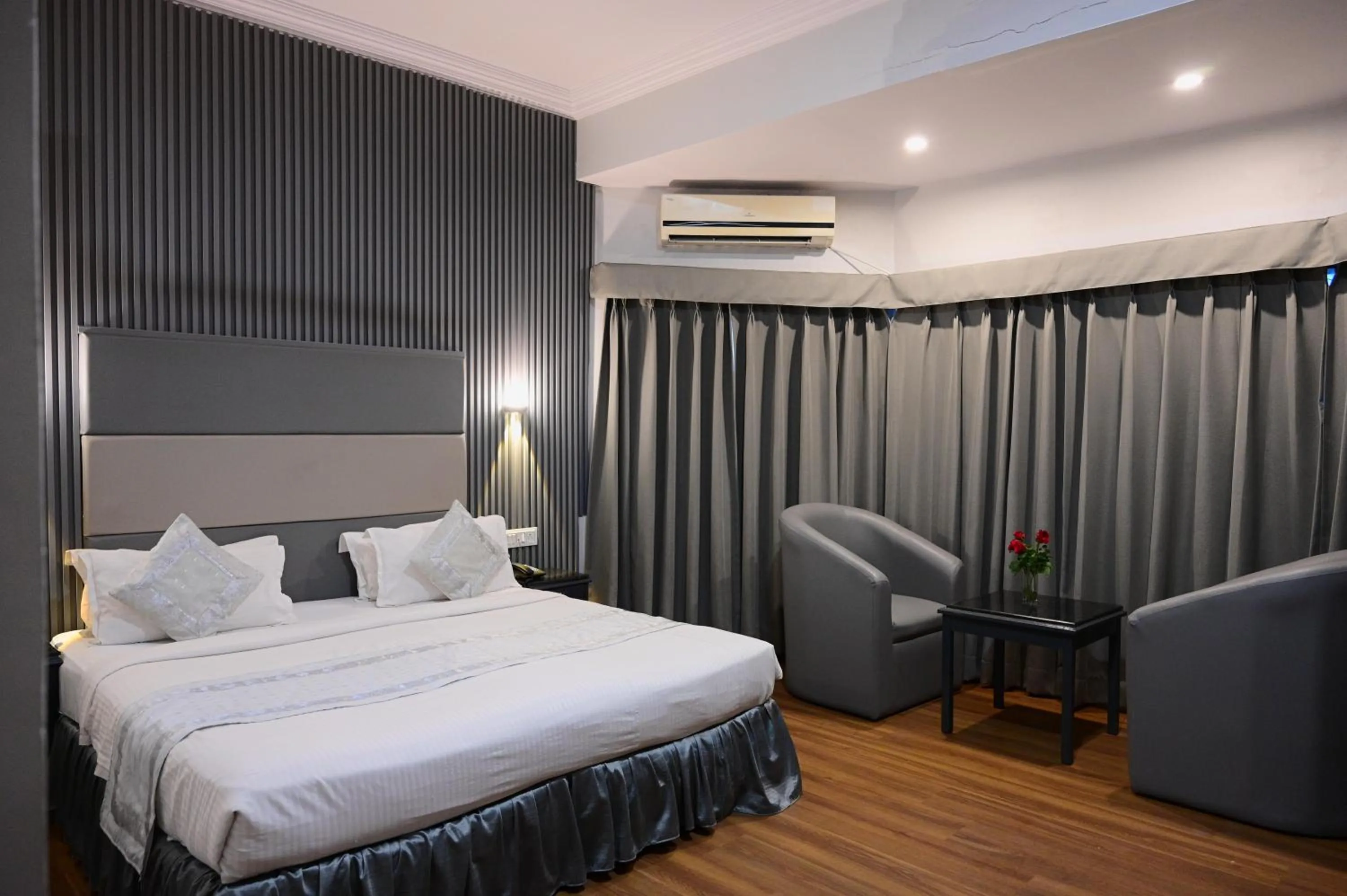 Bed in The Ambassador - Hotel & Conference Center