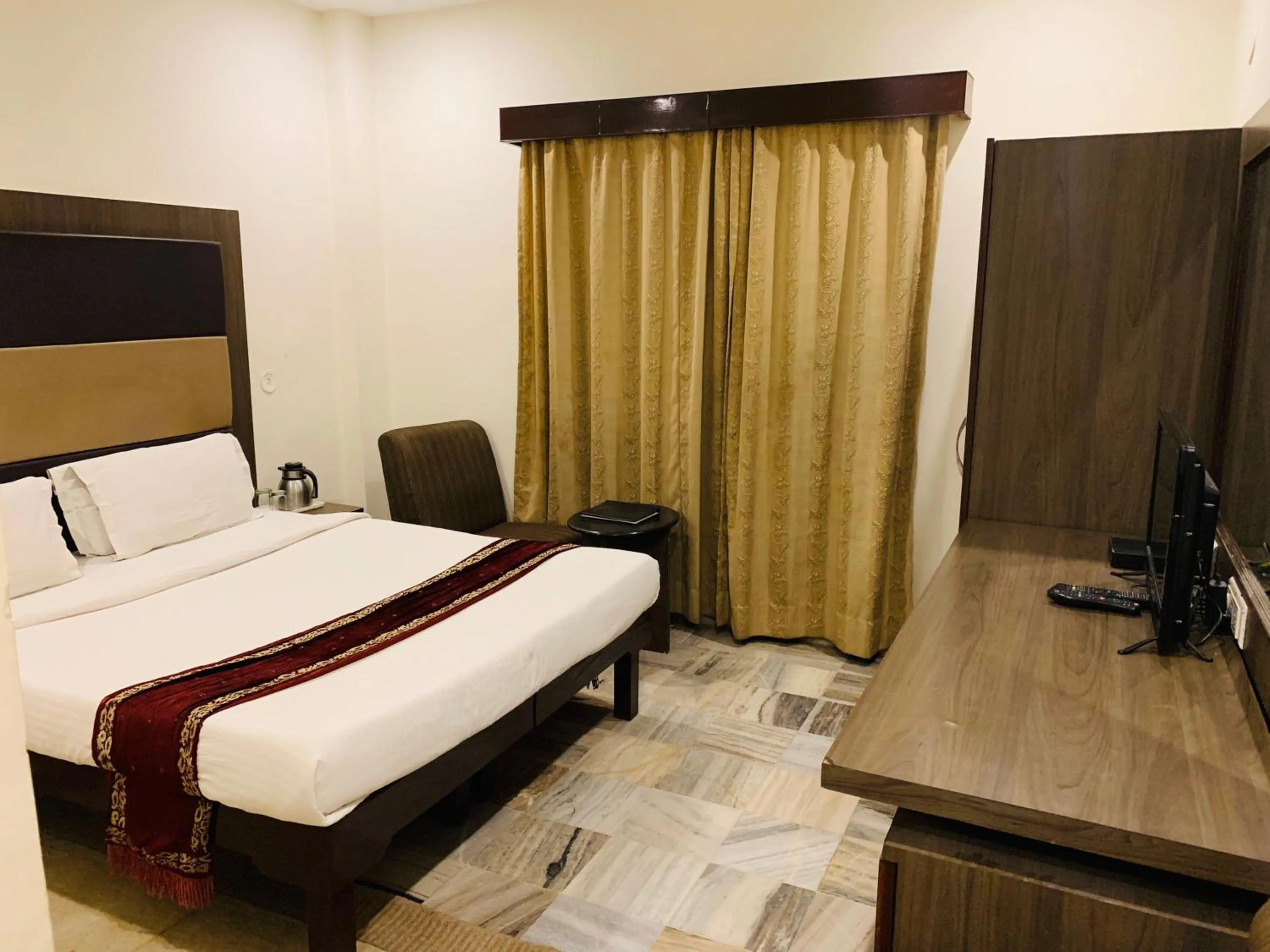 Bed in The Ambassador - Hotel & Conference Center