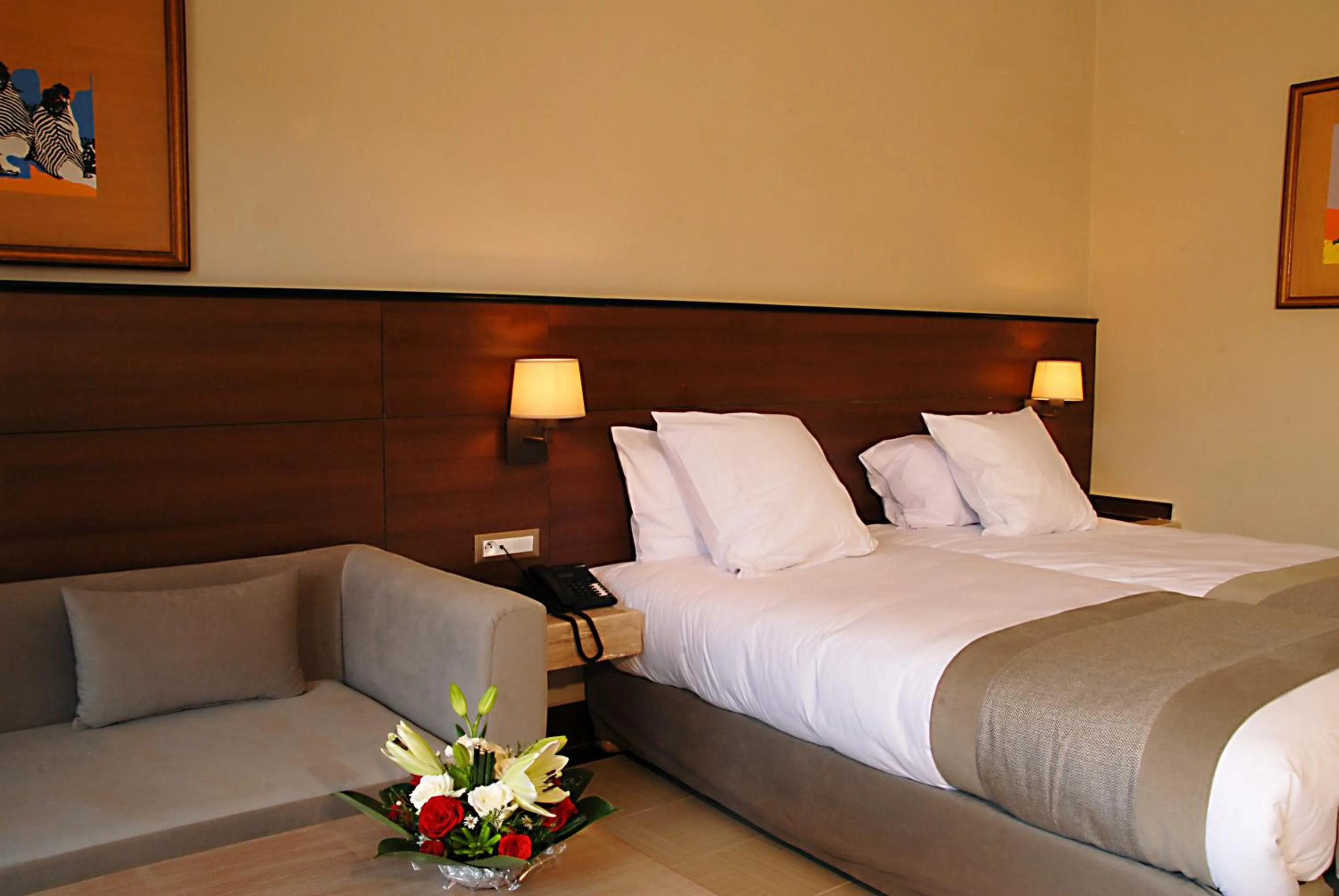 Bed in Oasis Palm Hotel