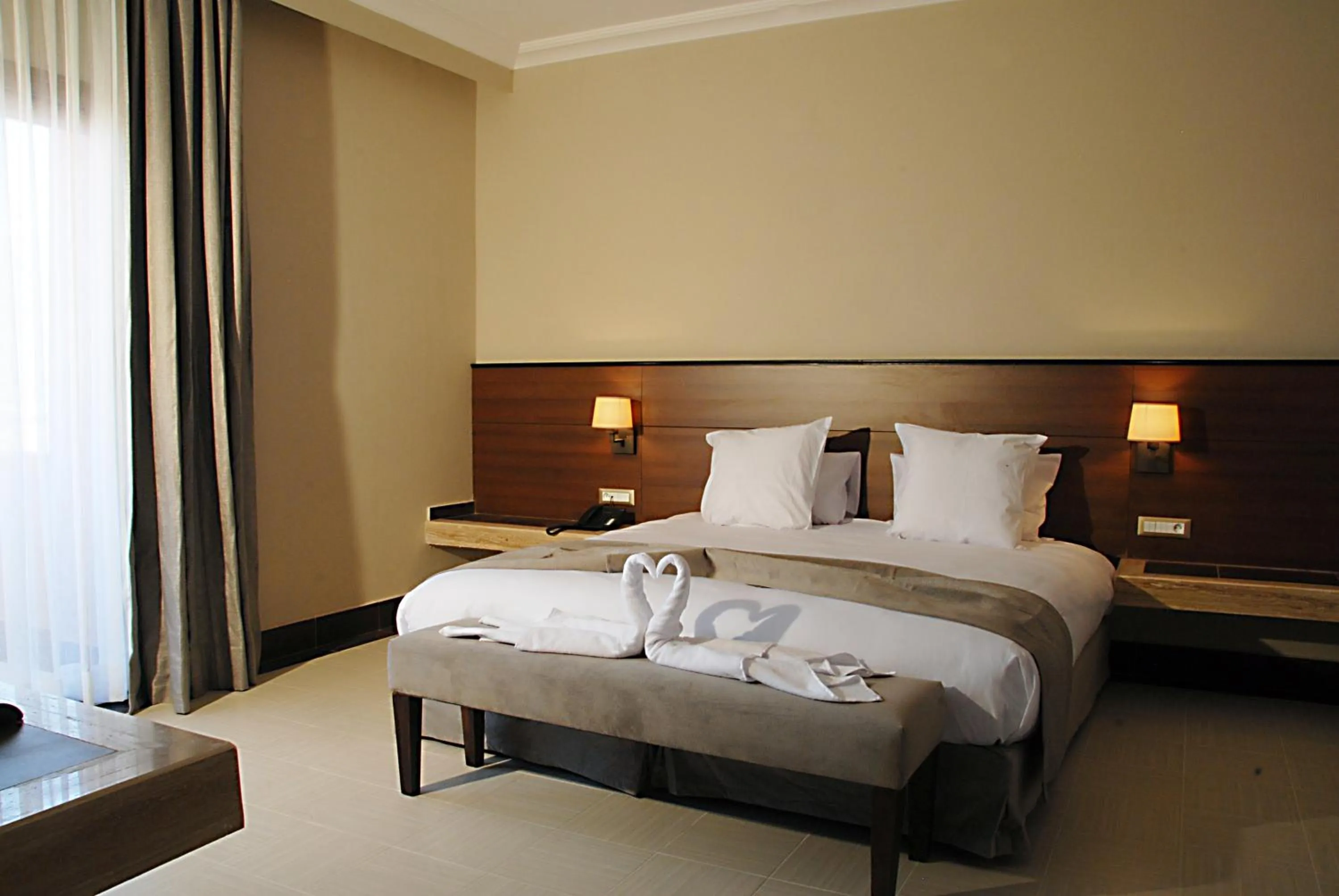 Bed in Oasis Palm Hotel