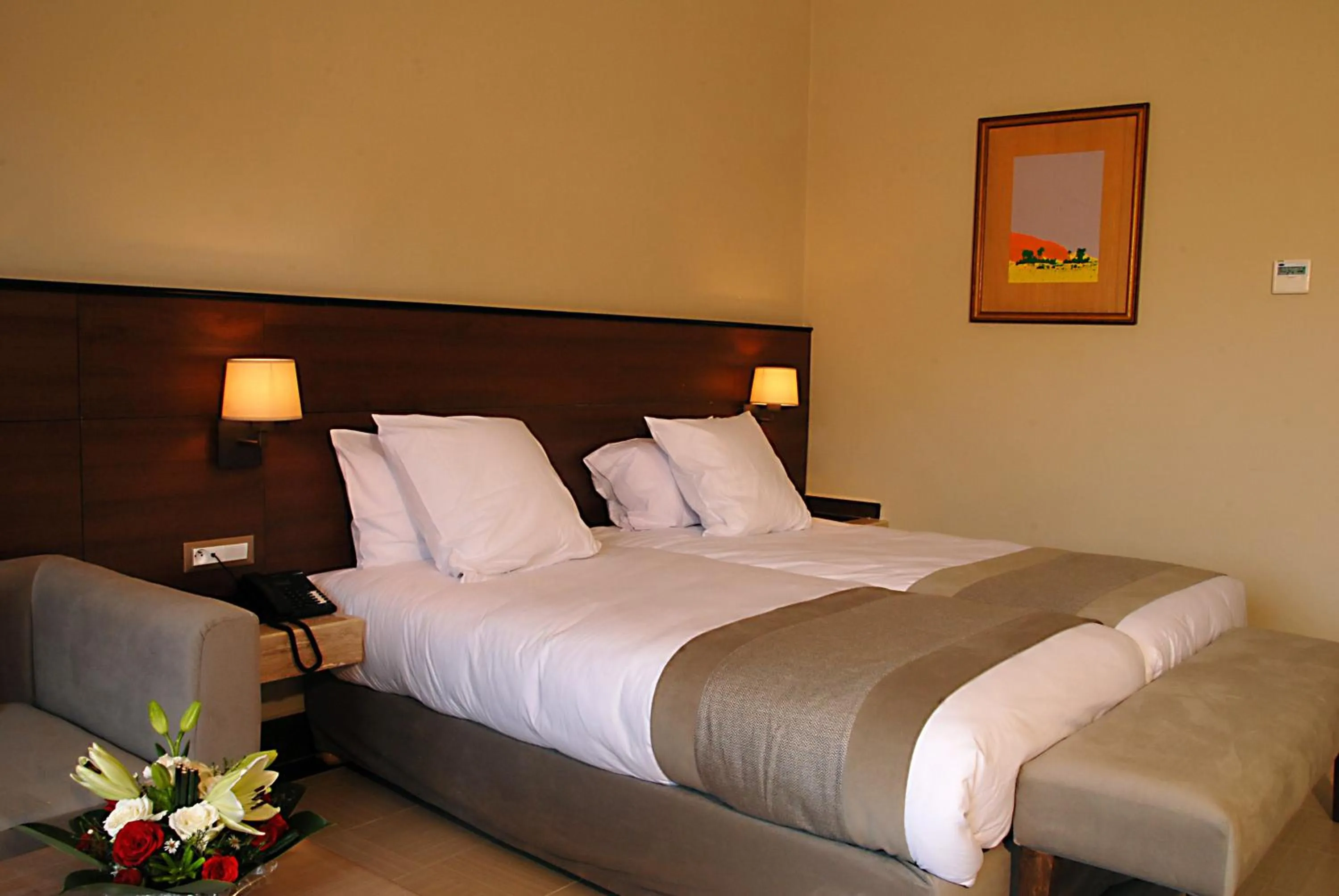 Bed in Oasis Palm Hotel