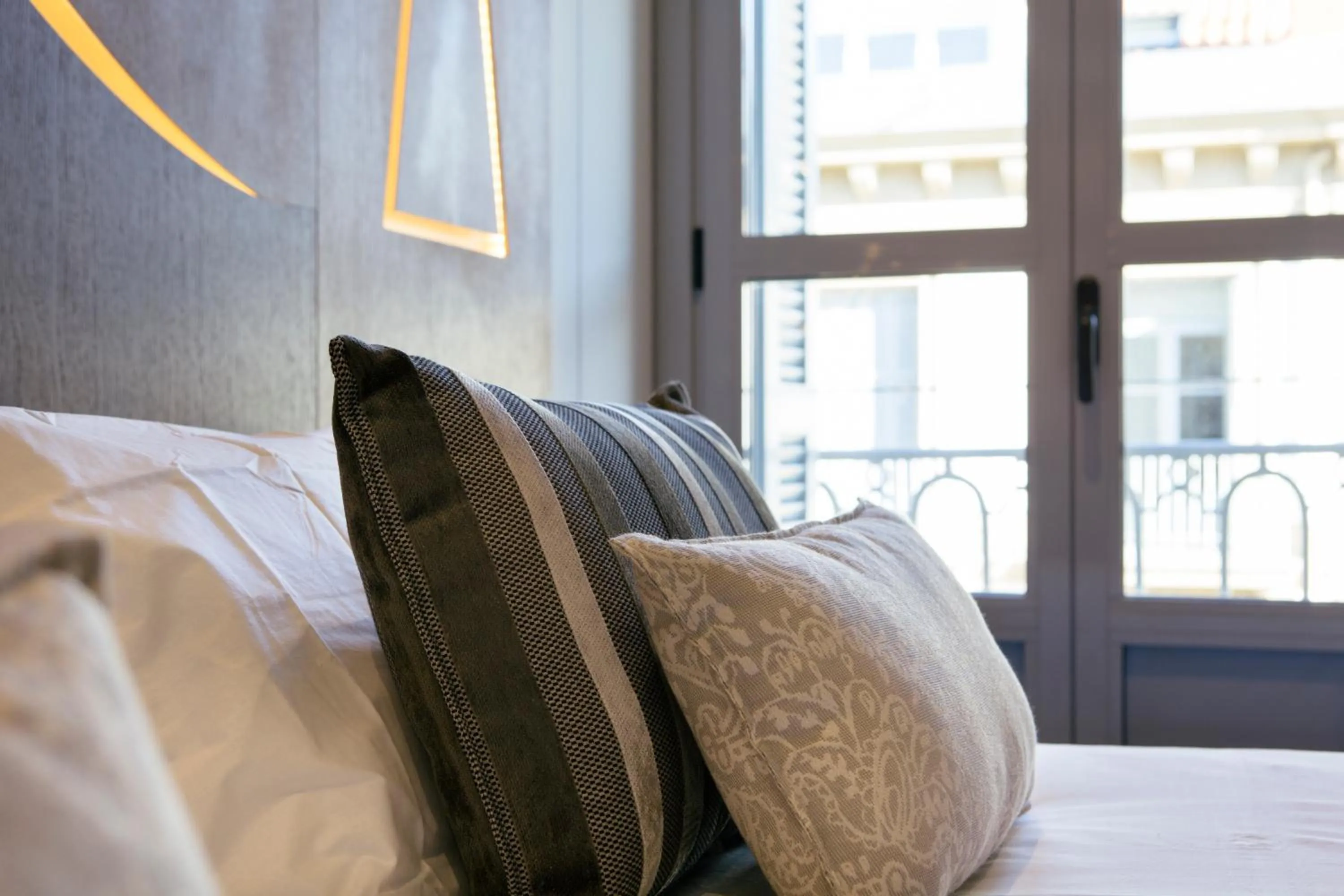 Decorative detail, Bed in Legazpi Doce Rooms & Suites