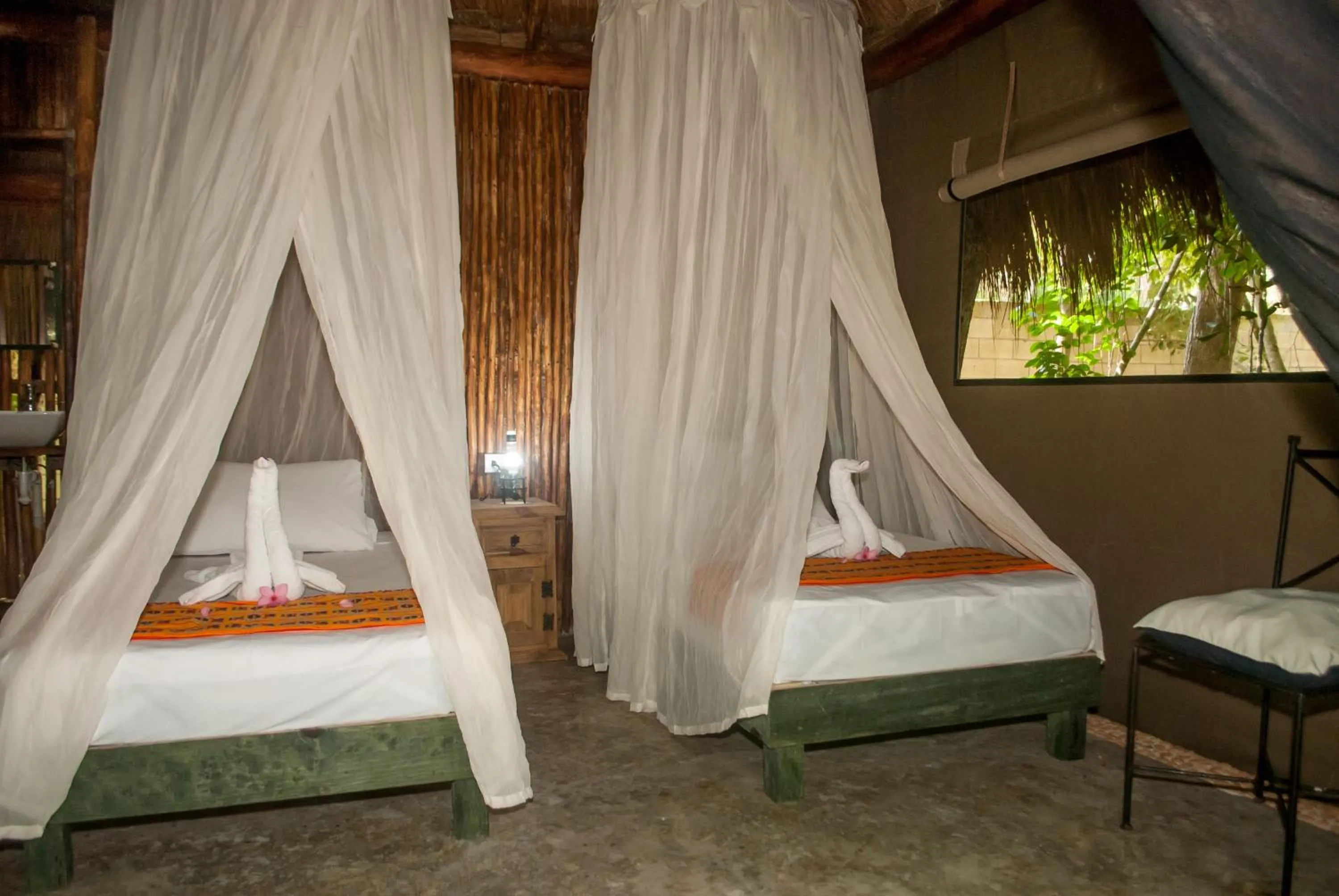 Bed in Akumal Natura Glamping