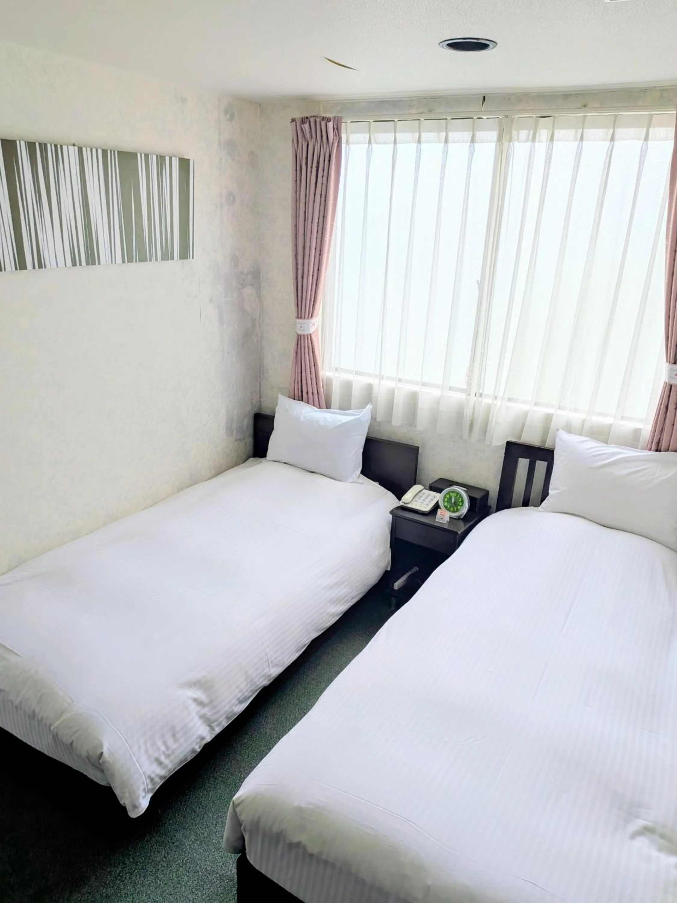 Bed in Sakura Hotel Oami