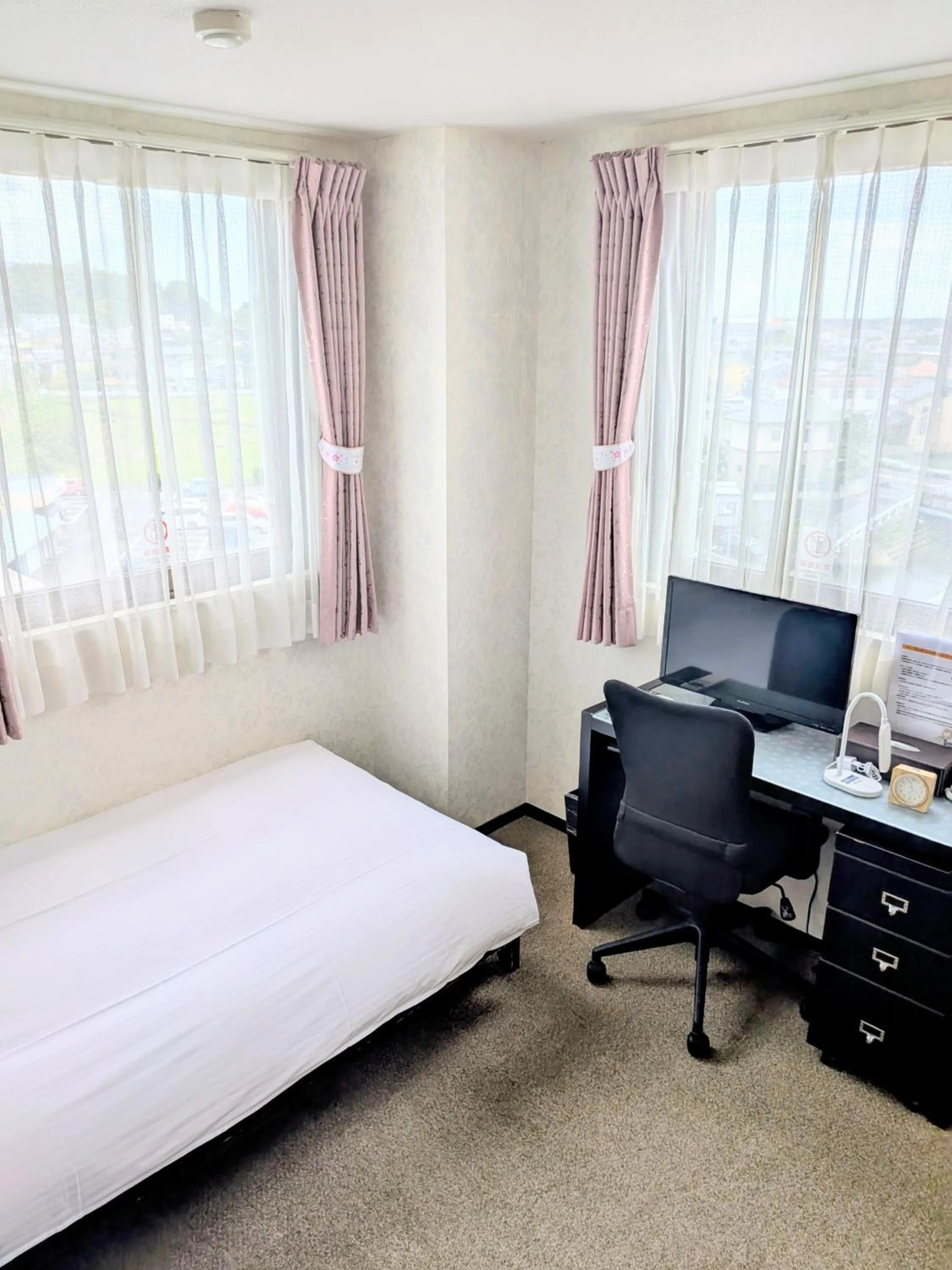 Bed in Sakura Hotel Oami