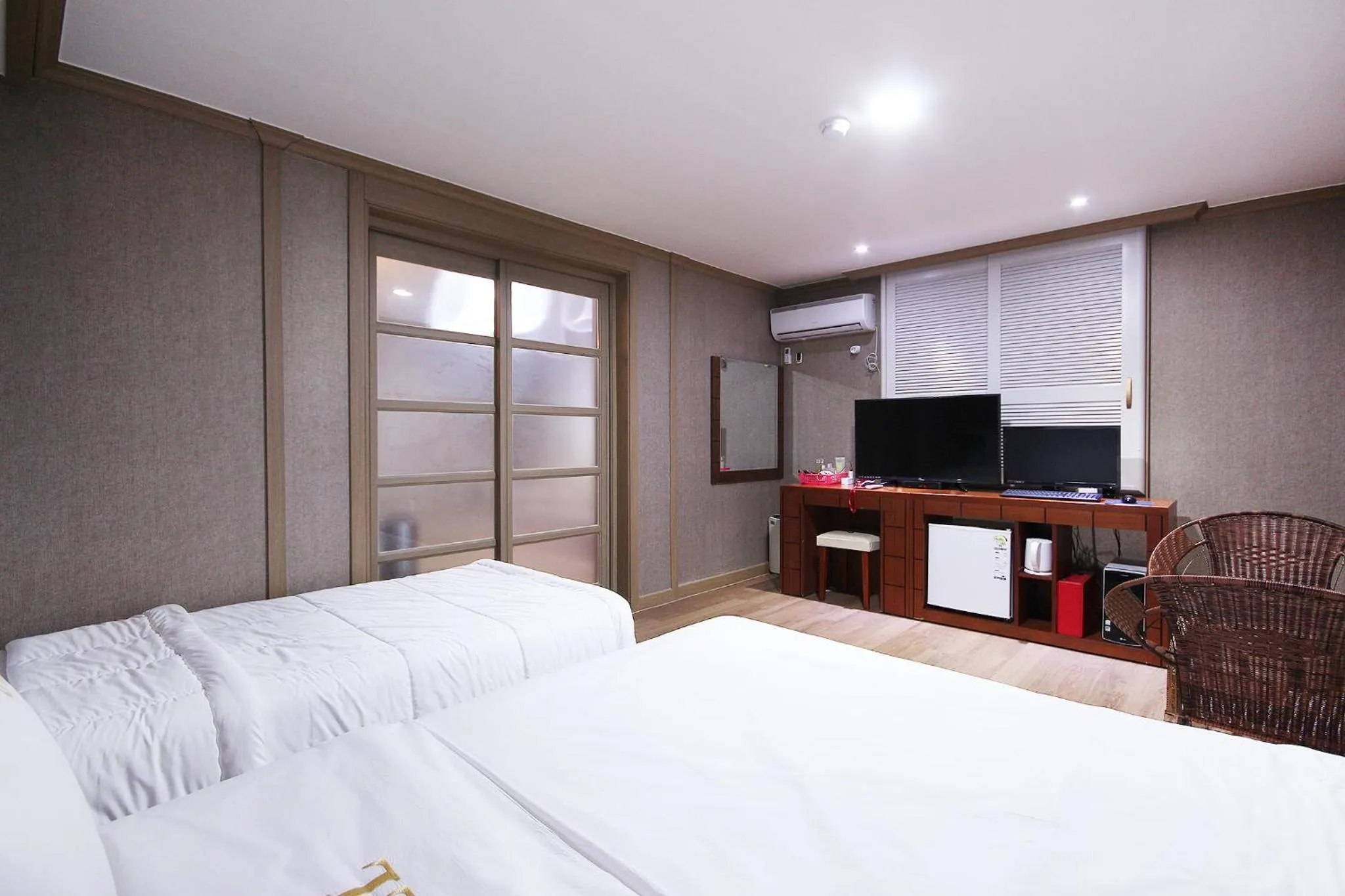 Bed in Happy Q Motel