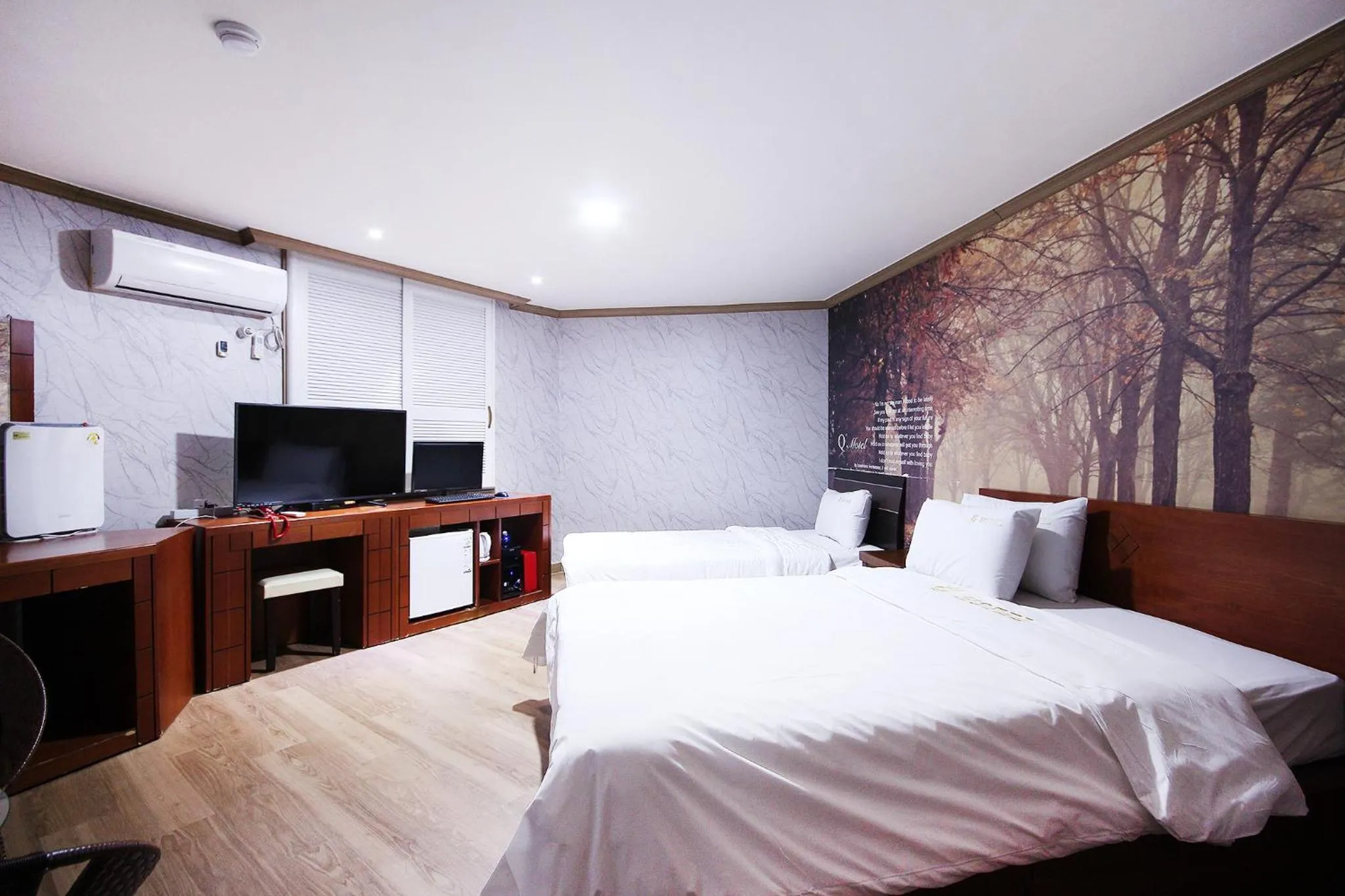 Bed in Happy Q Motel