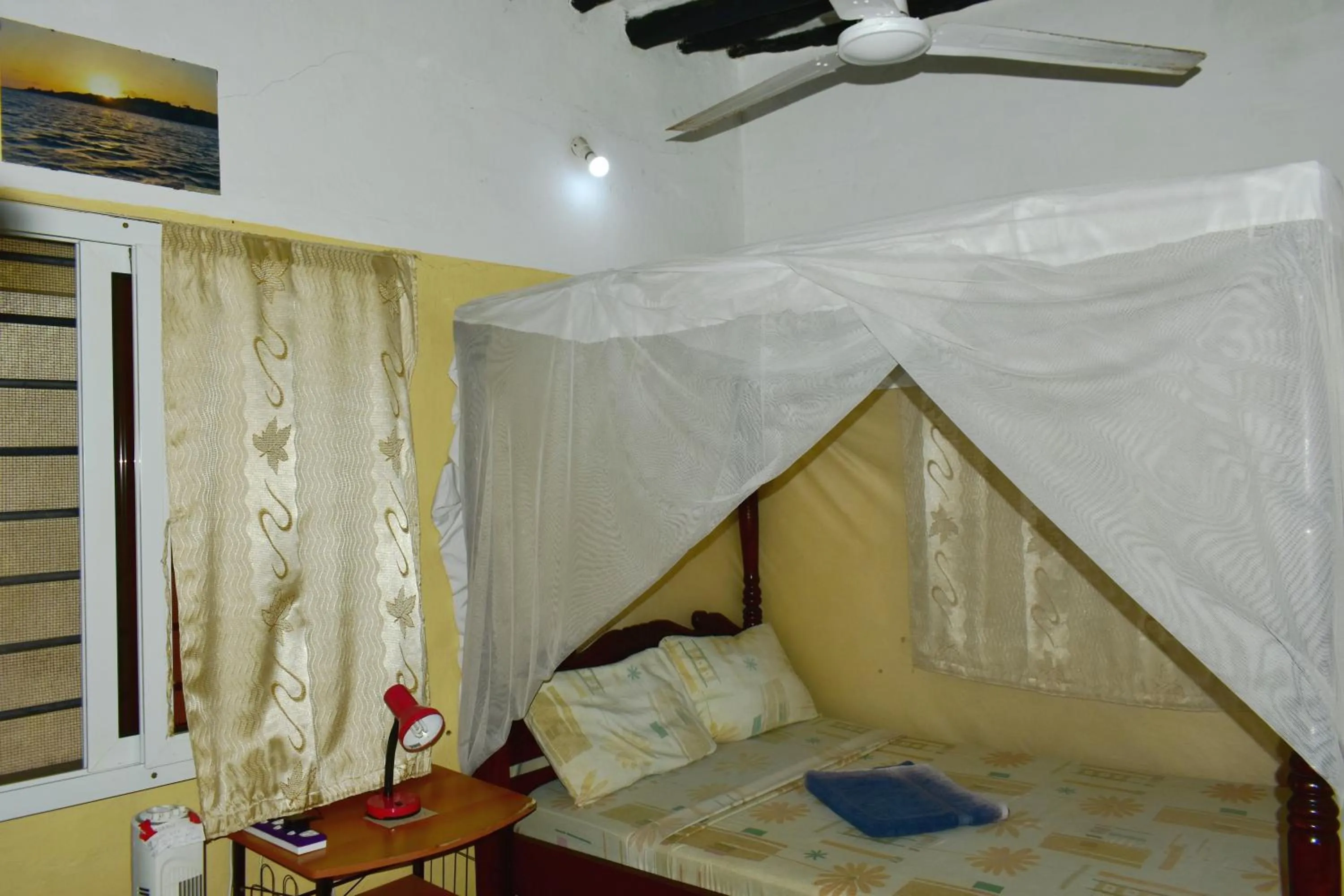 Photo of the whole room, Bed in JamboHouse Lamu