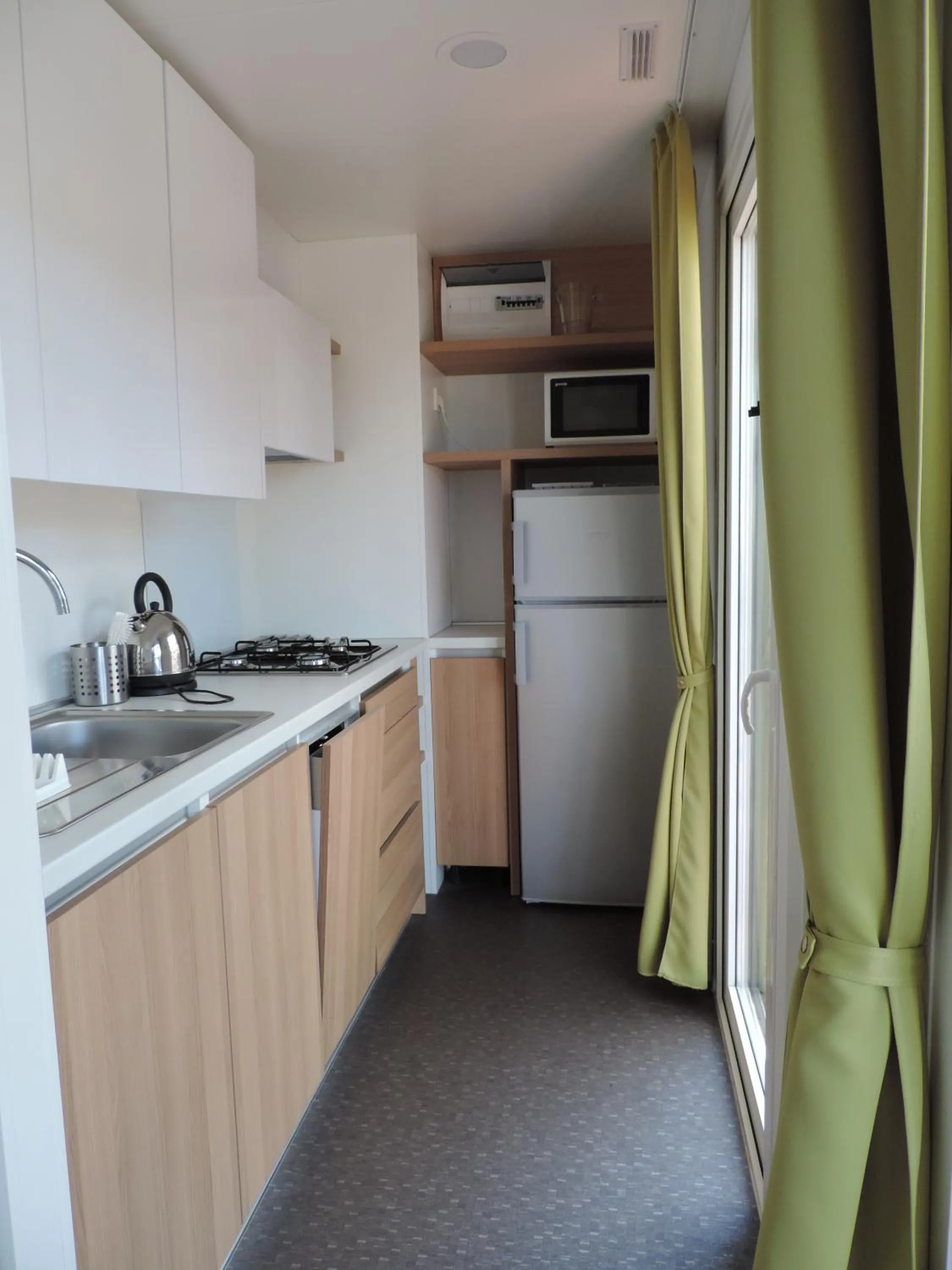 Kitchen or kitchenette in Victoria Mobilehome Tortoreto Lido