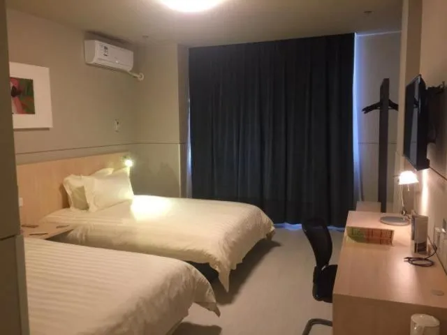 Bed in Magnolia Hotel Cangzhou West Railway Station Jiefang Road