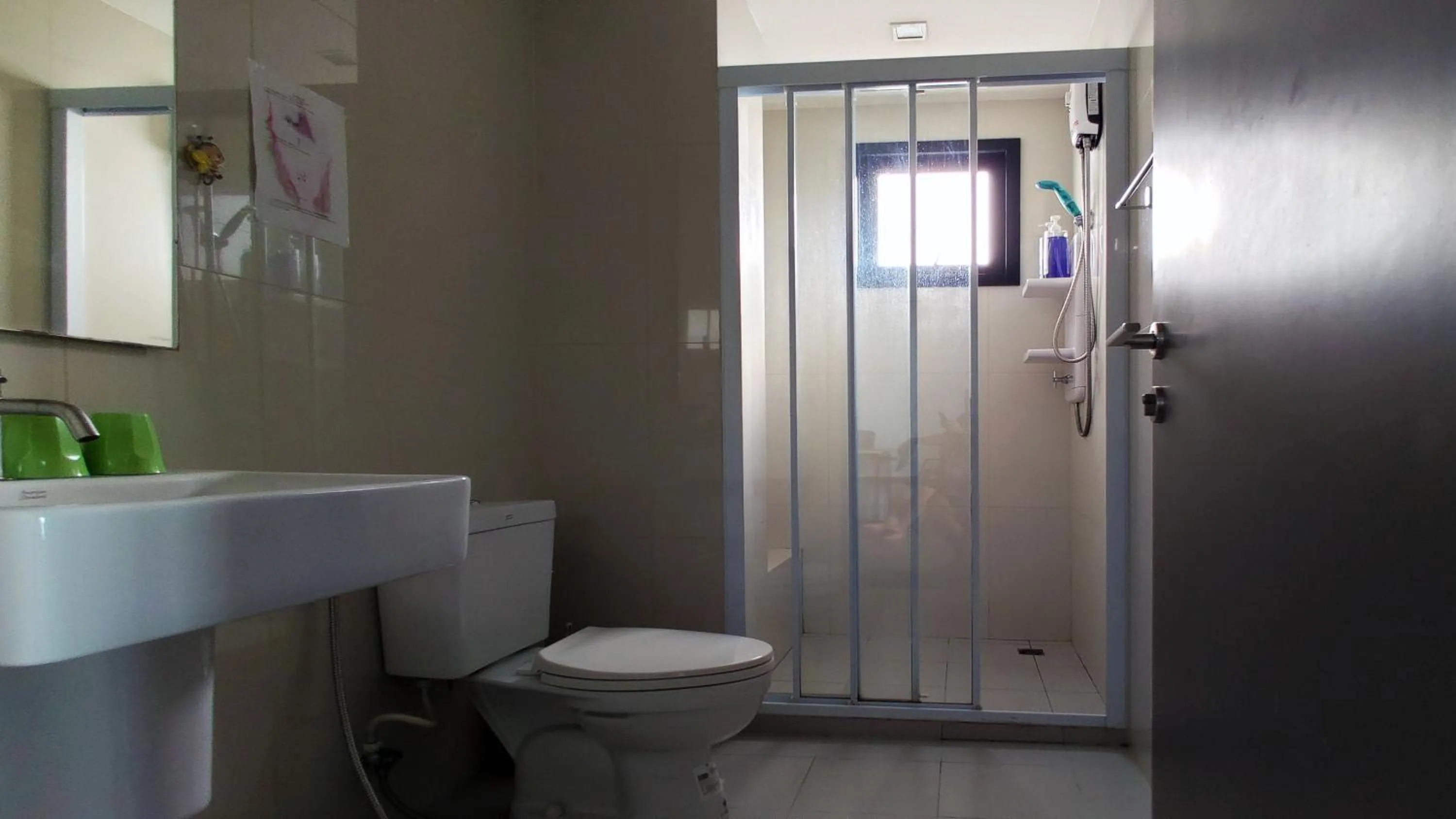 Bathroom in Many Holiday The Base Condo