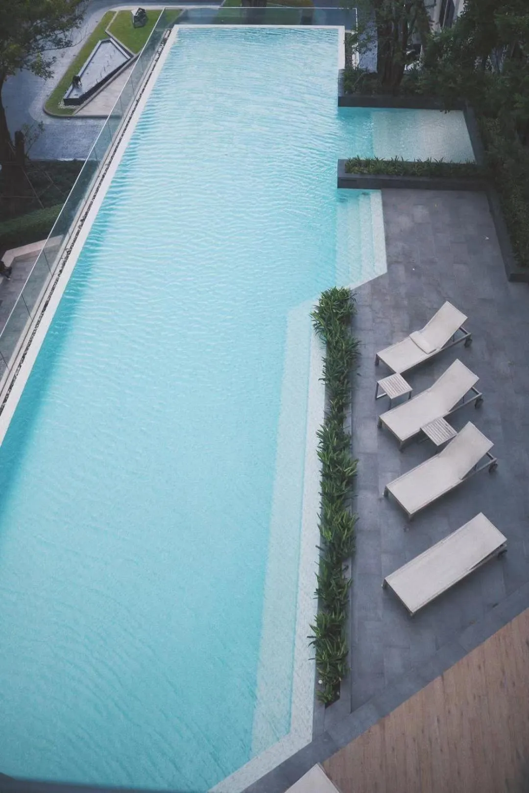 Pool view in Many Holiday The Base Condo