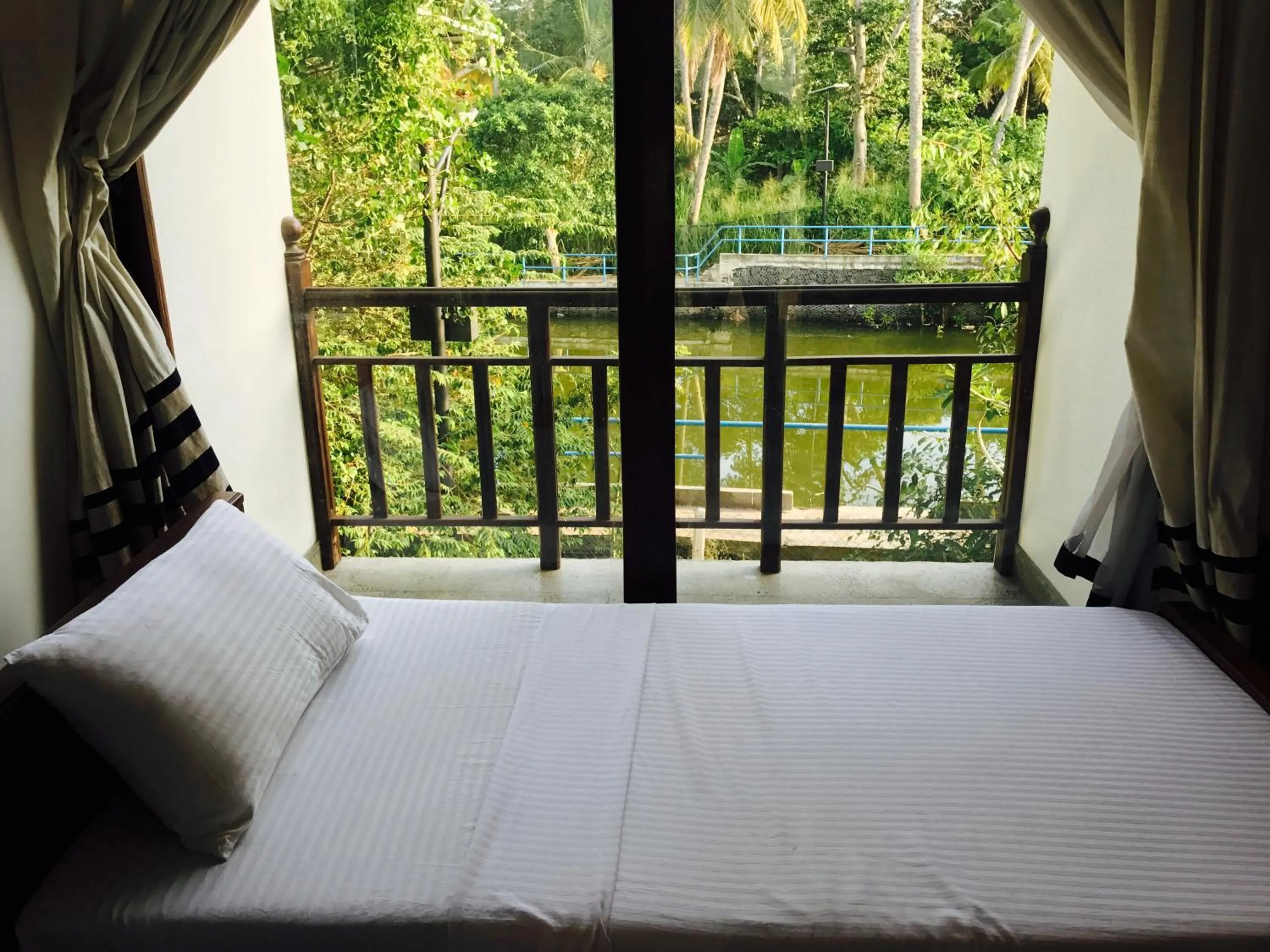 River view, Bed in Lagoon Boutique Hotel