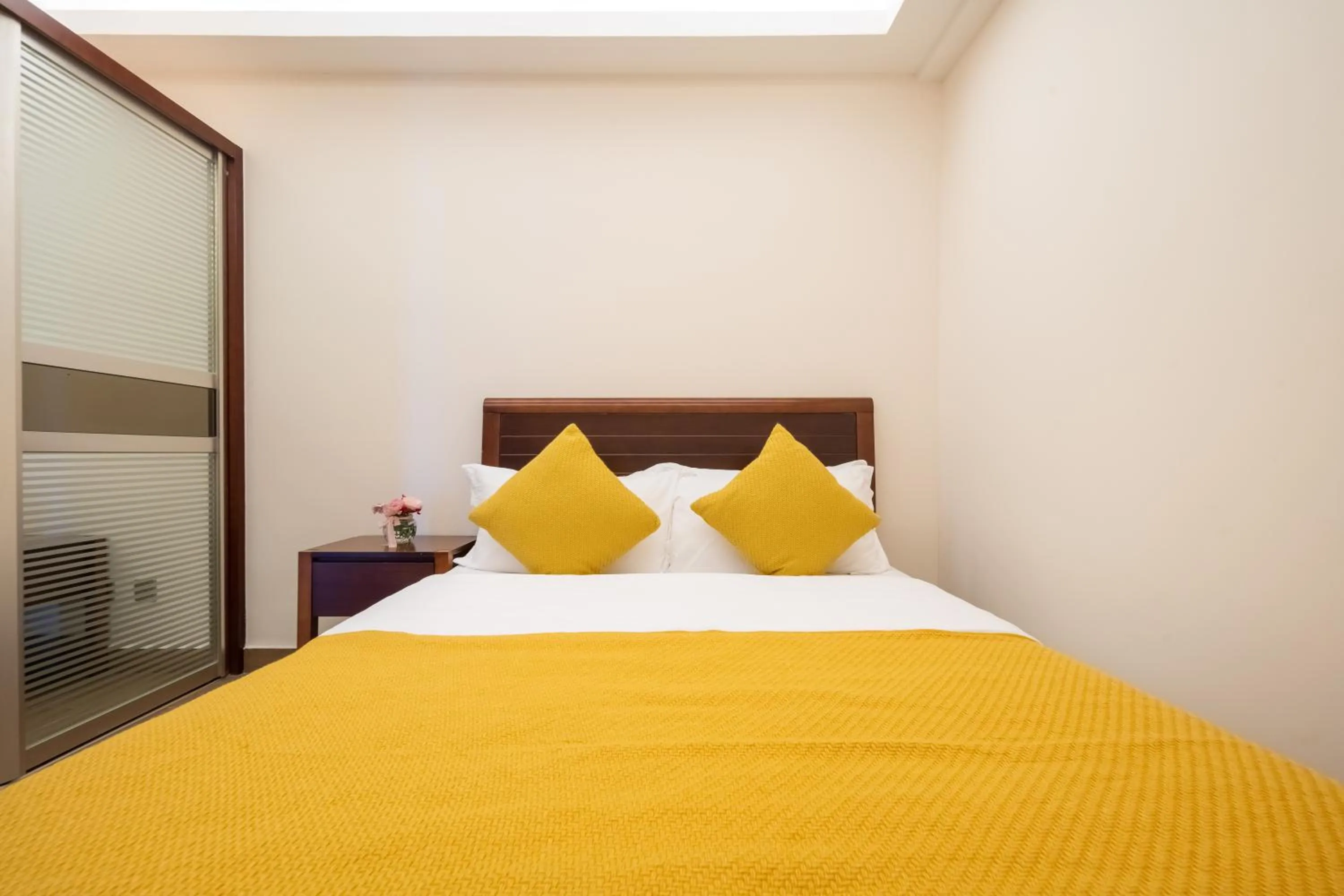 Bed in Sanya Yikehai View Apartments