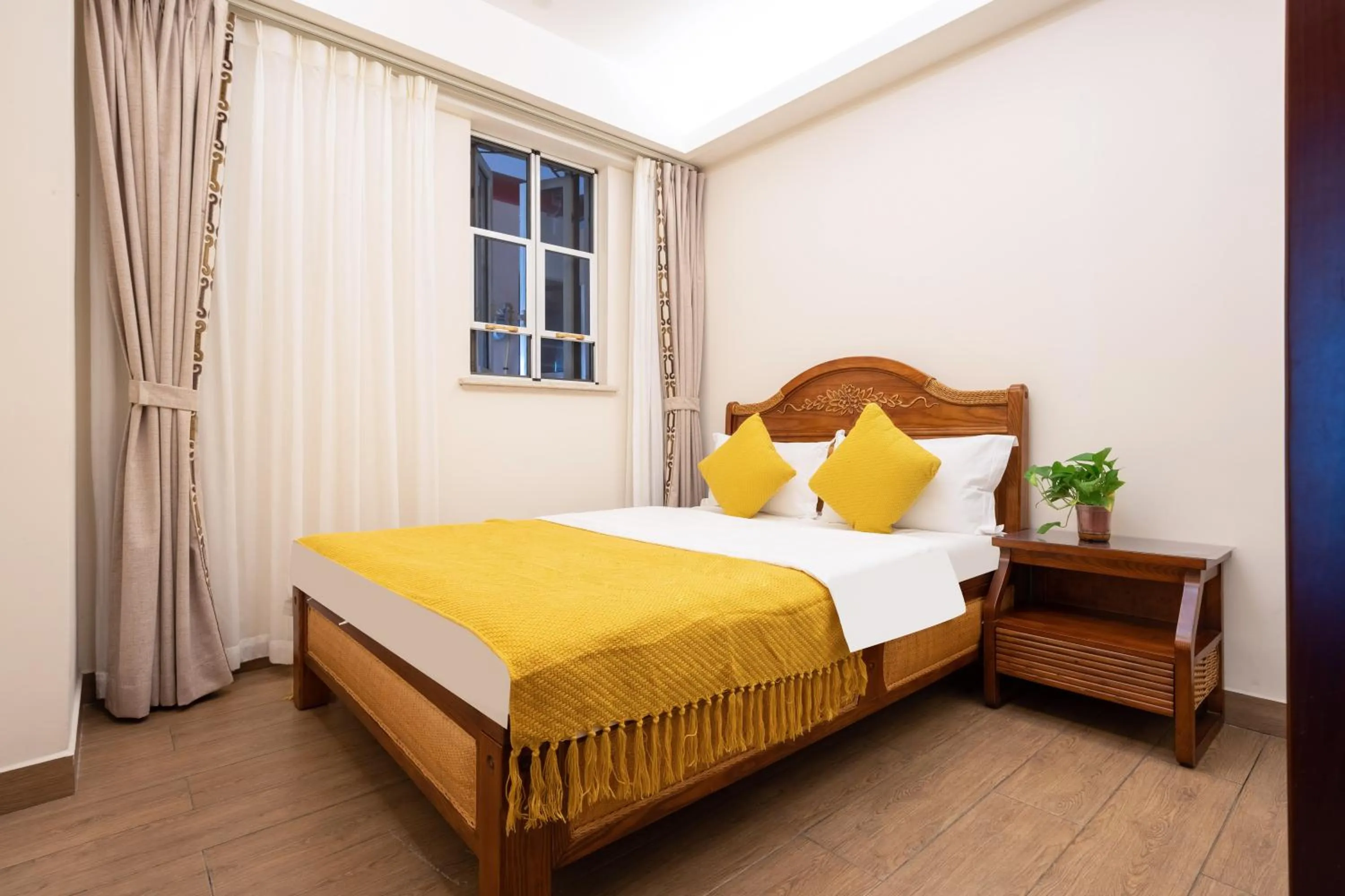 Bed in Sanya Yikehai View Apartments