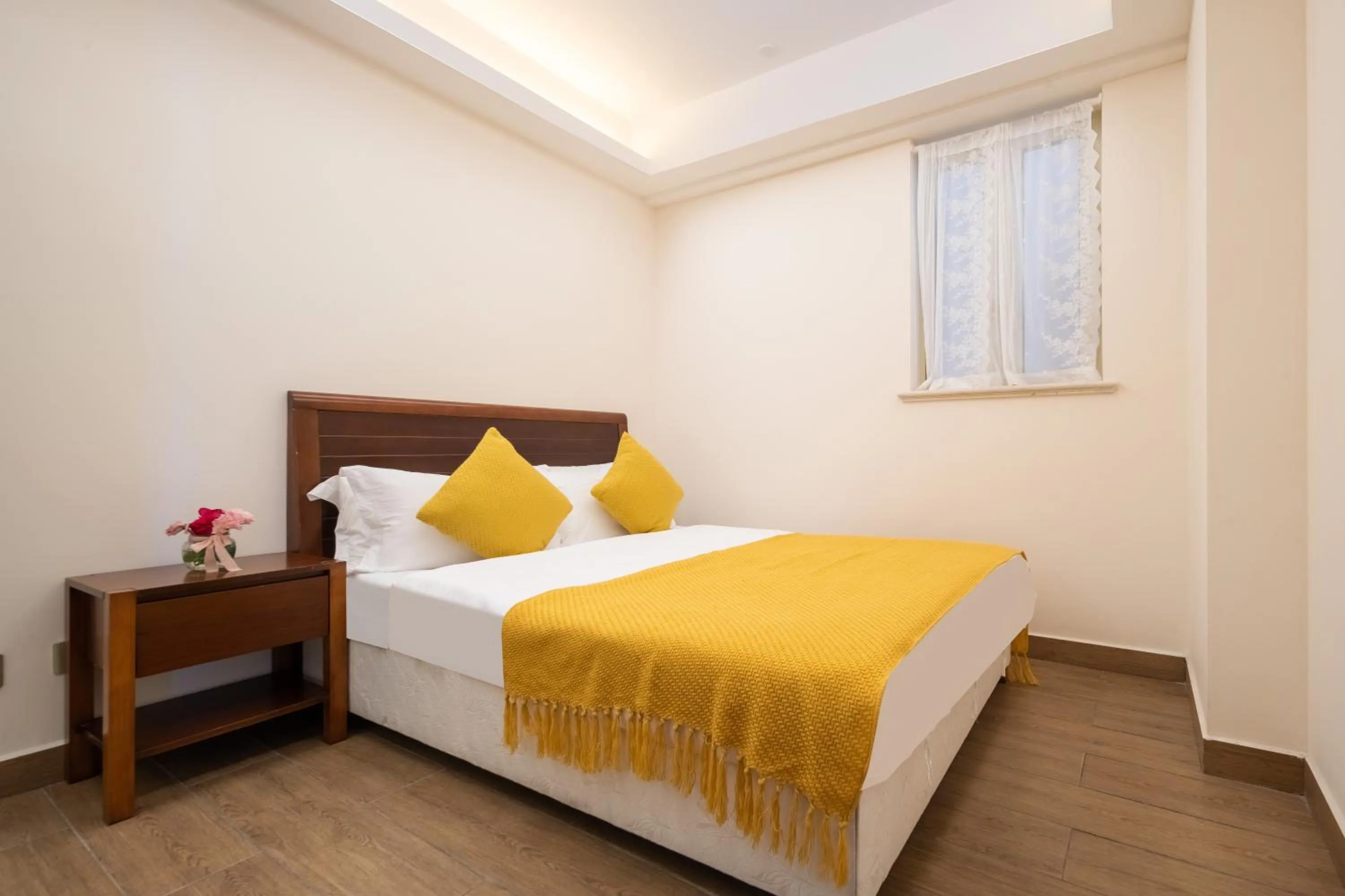 Bed in Sanya Yikehai View Apartments